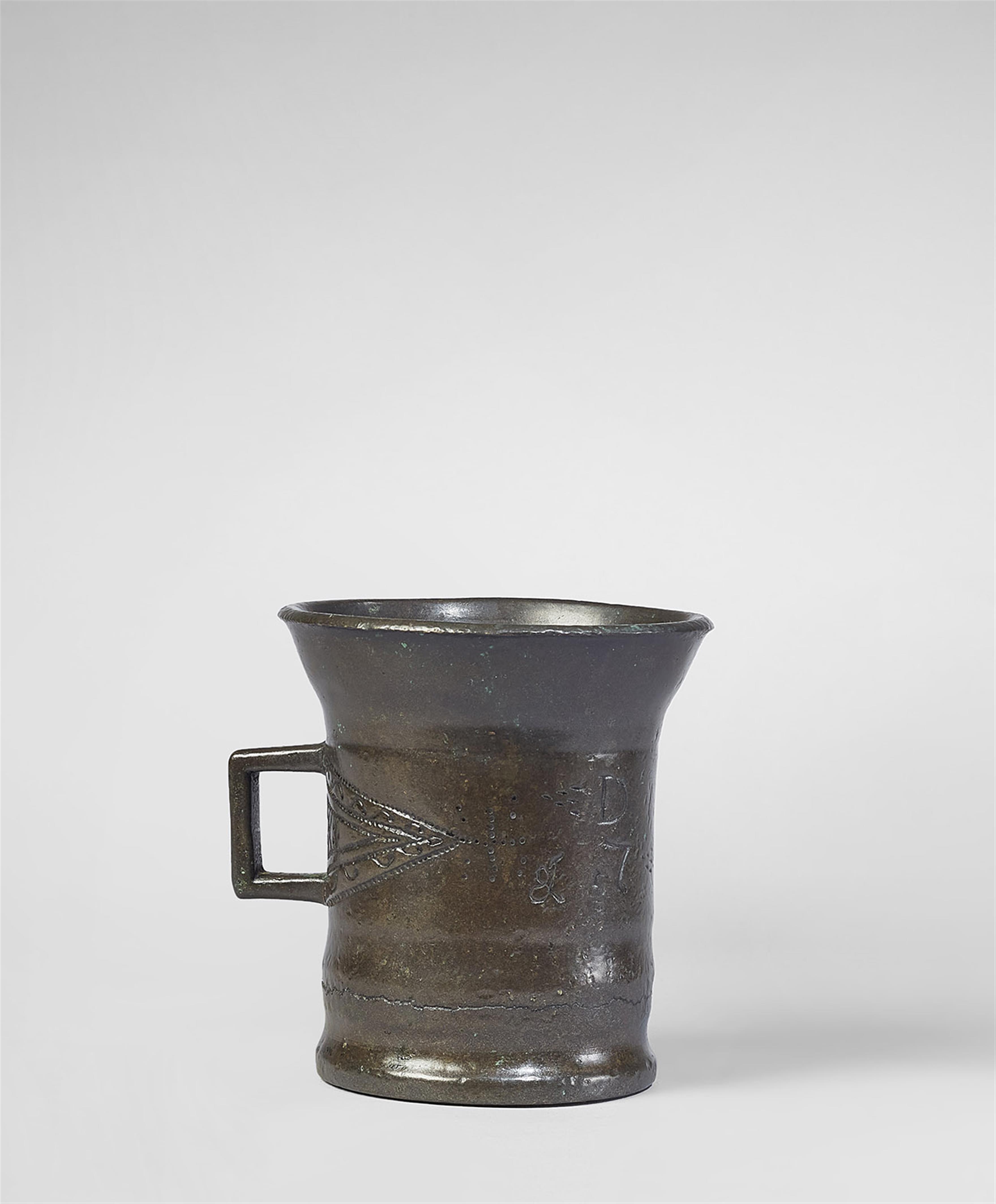 A small single-handled mortar dated 1728 - image-3