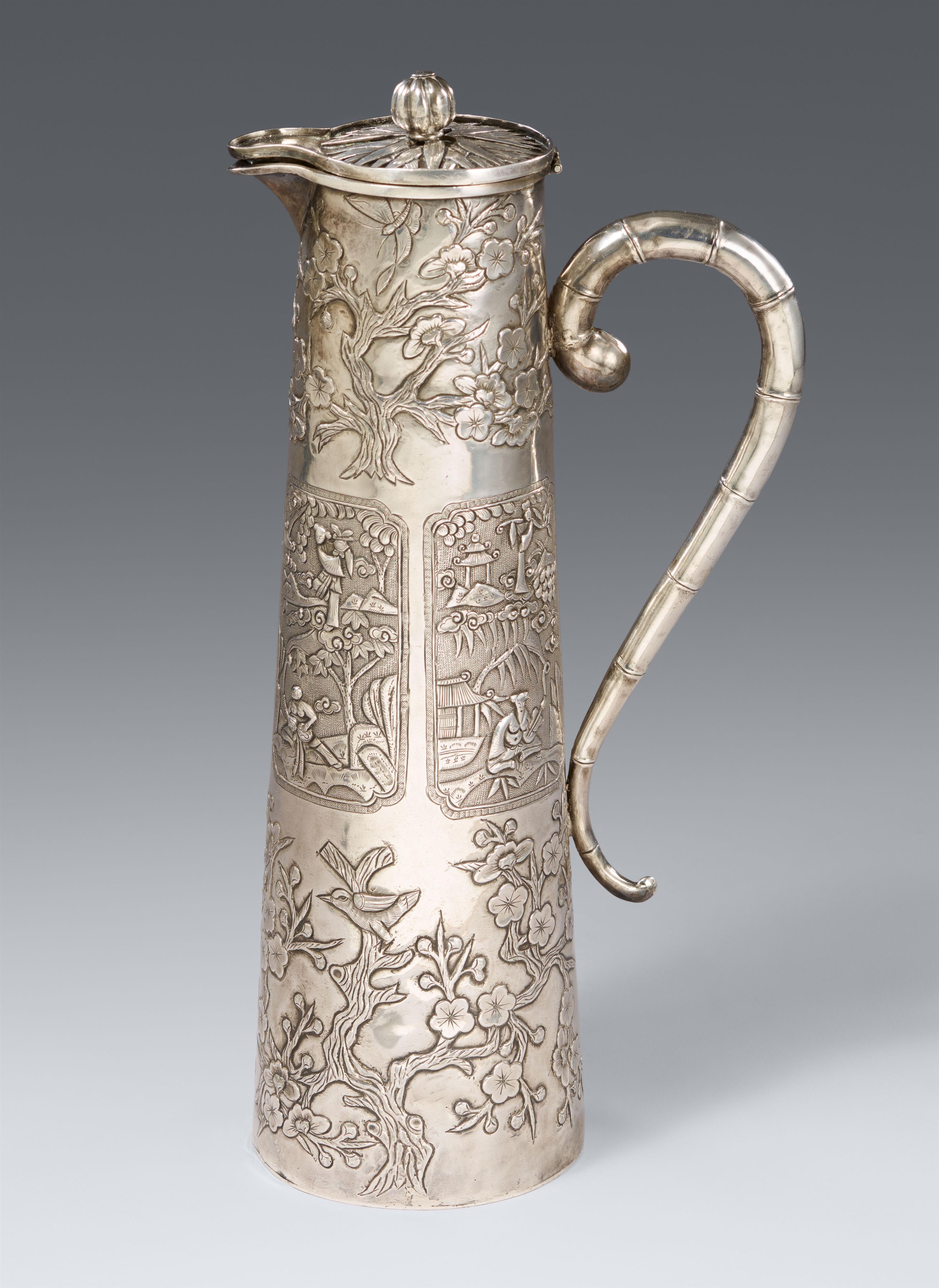 An elongated silver hot water ewer. Around 1900 - image-1