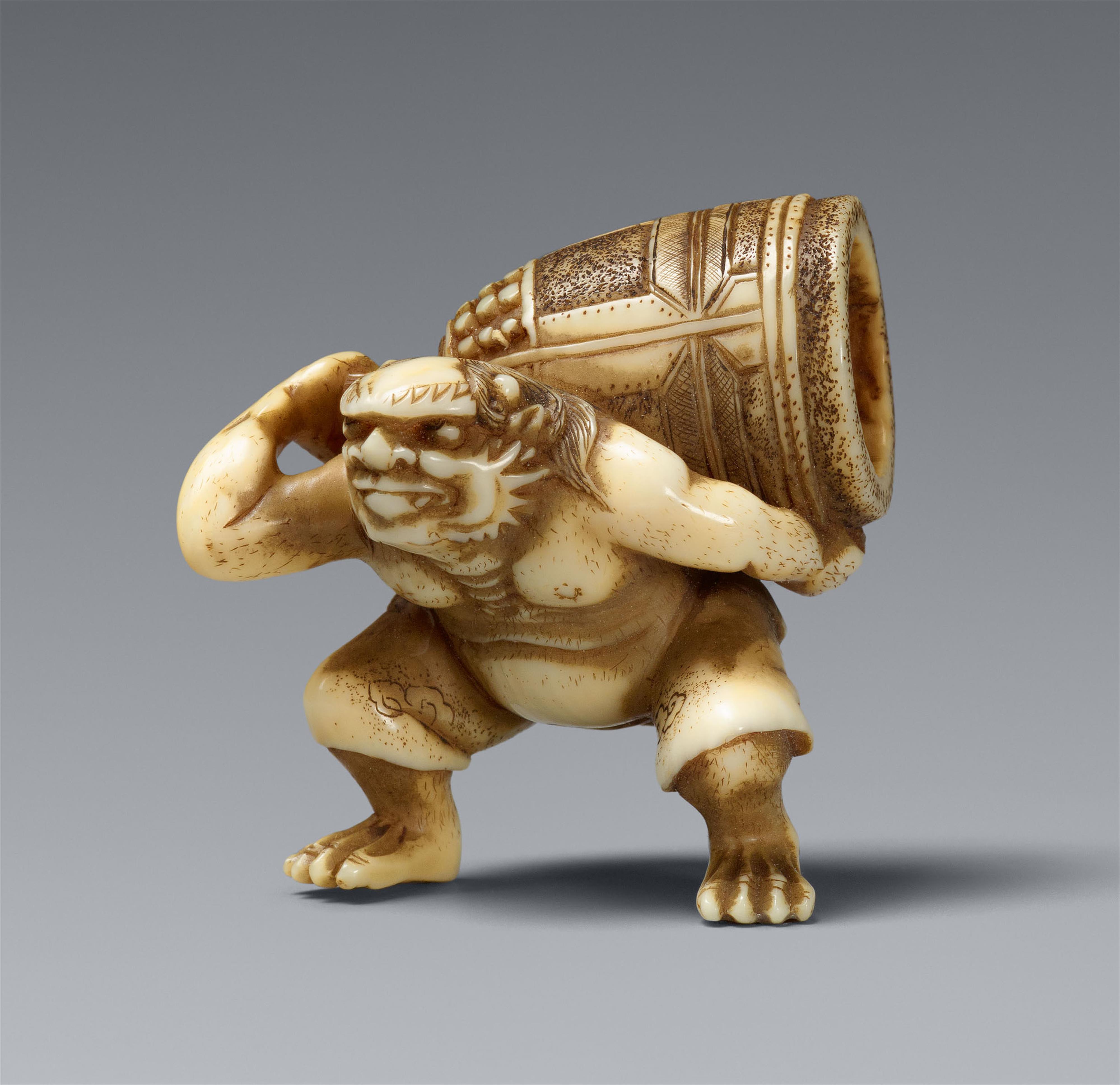 An ivory netsuke of an oni with a bell. Second half 19th century - image-1