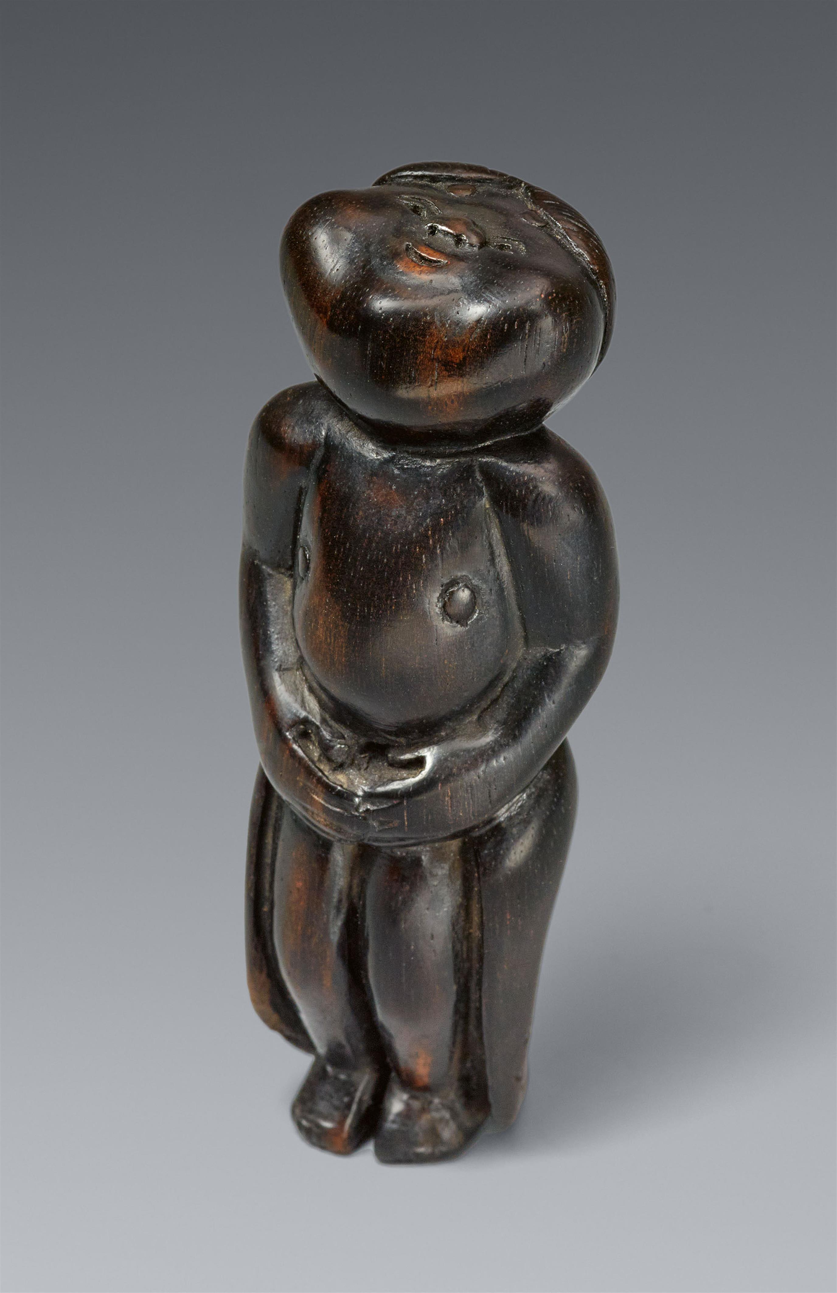 A kurogaki netsuke of an okame. 19th century - image-1