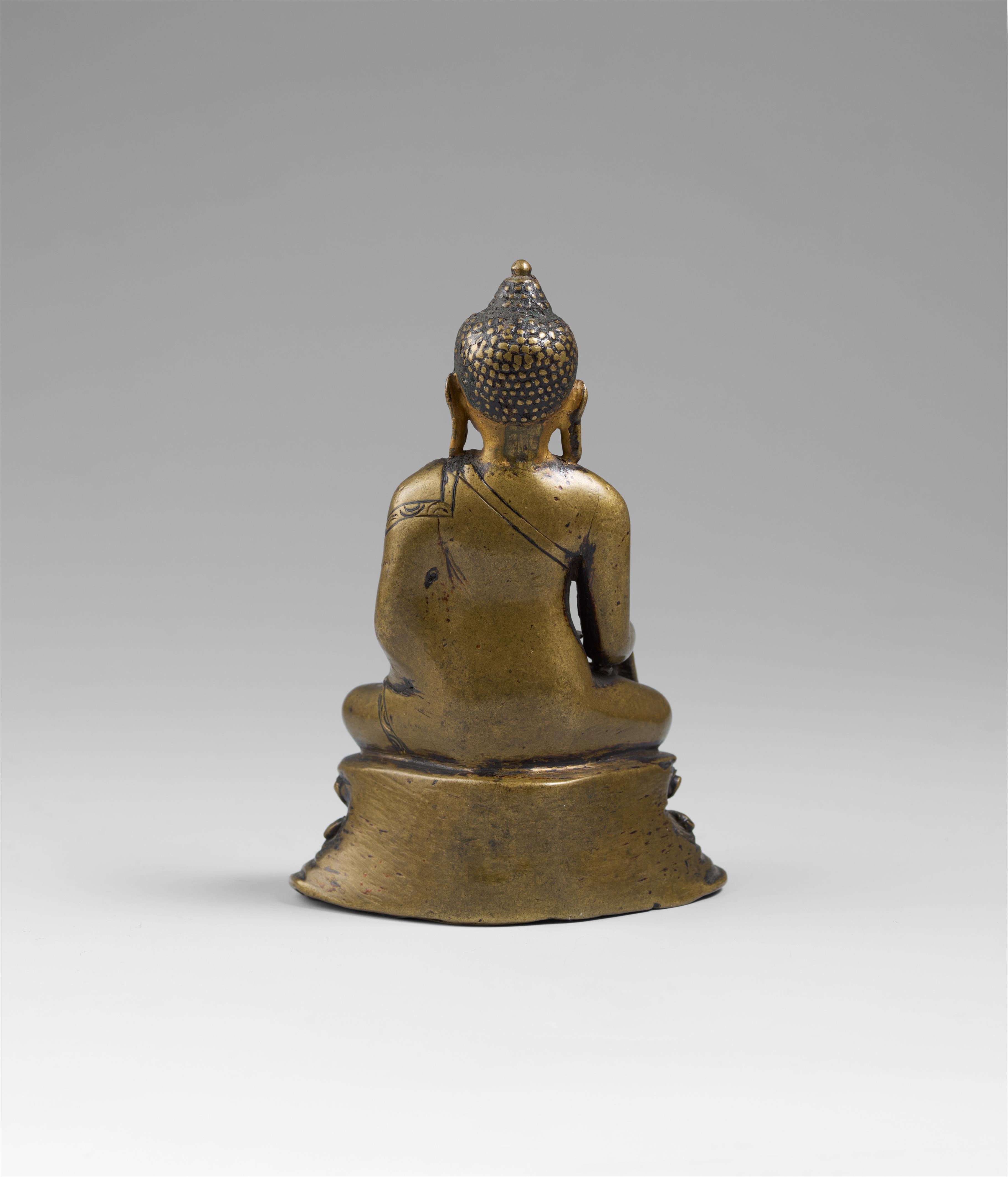 A Tibetan copper alloy figure of Buddha Shakyamuni with cold gold. 14th/15 century - image-2