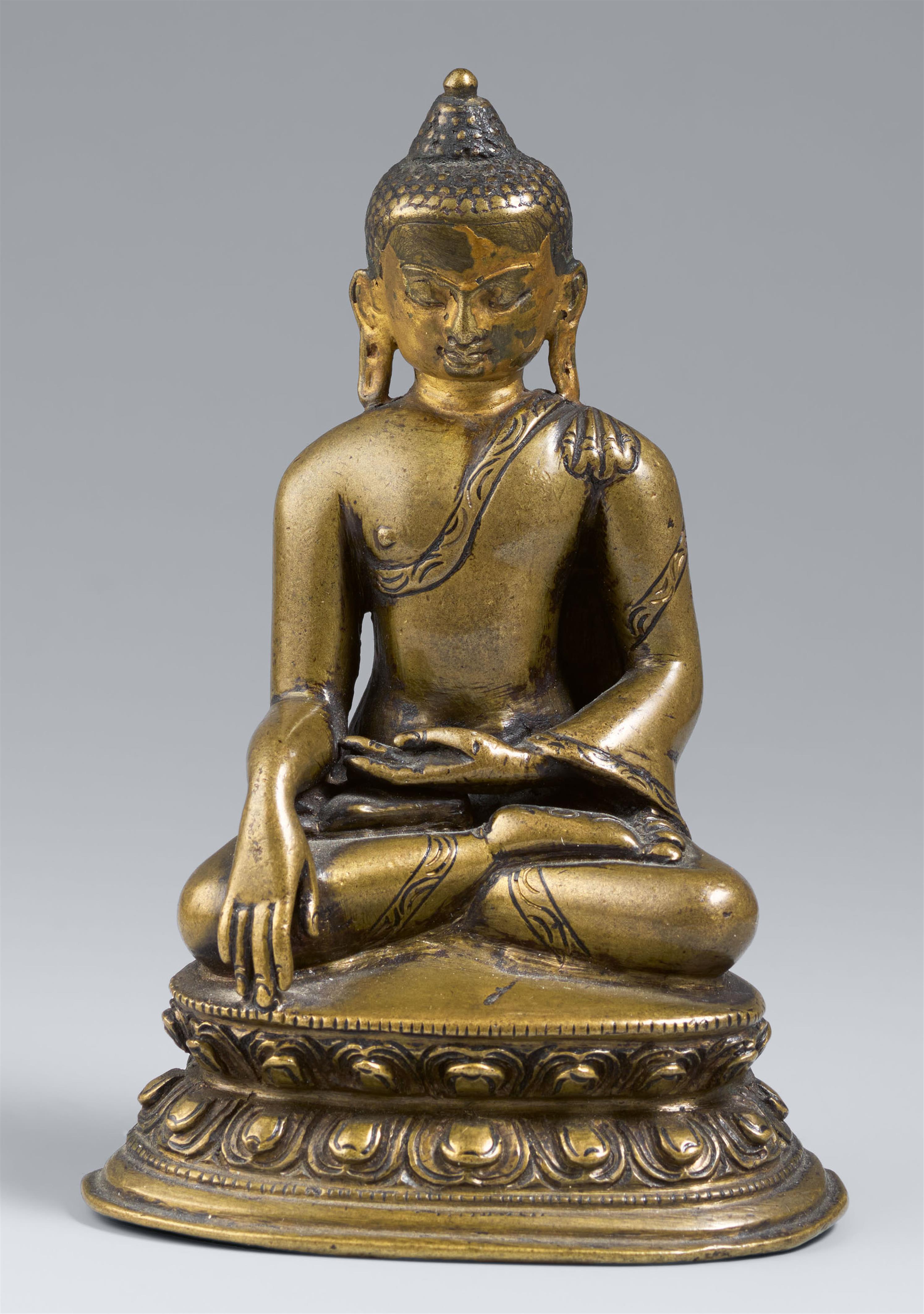 A Tibetan copper alloy figure of Buddha Shakyamuni with cold gold. 14th/15 century - image-1