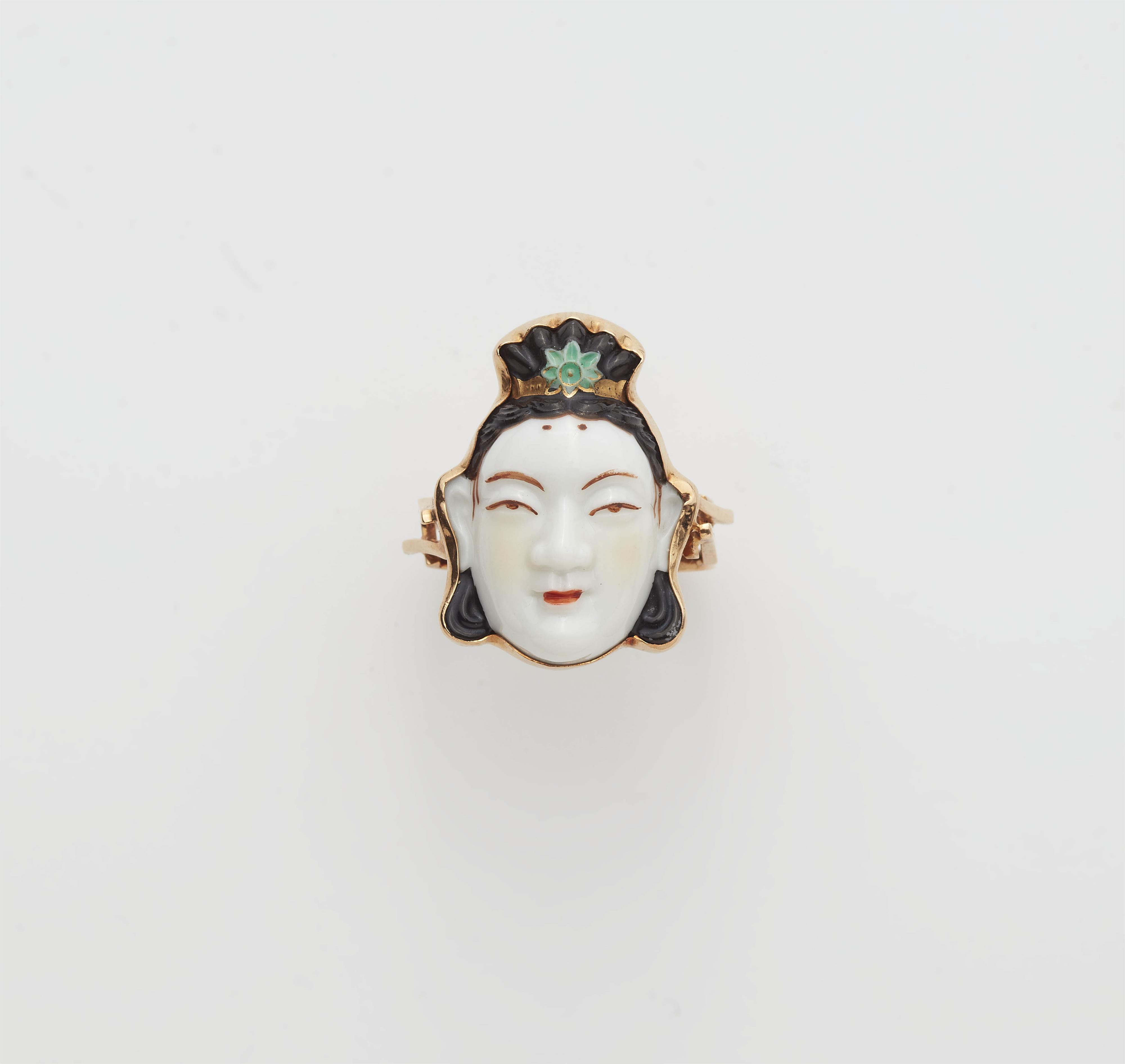 A Japanese 18k gold and porcelain Toshikane mask ring. - image-1