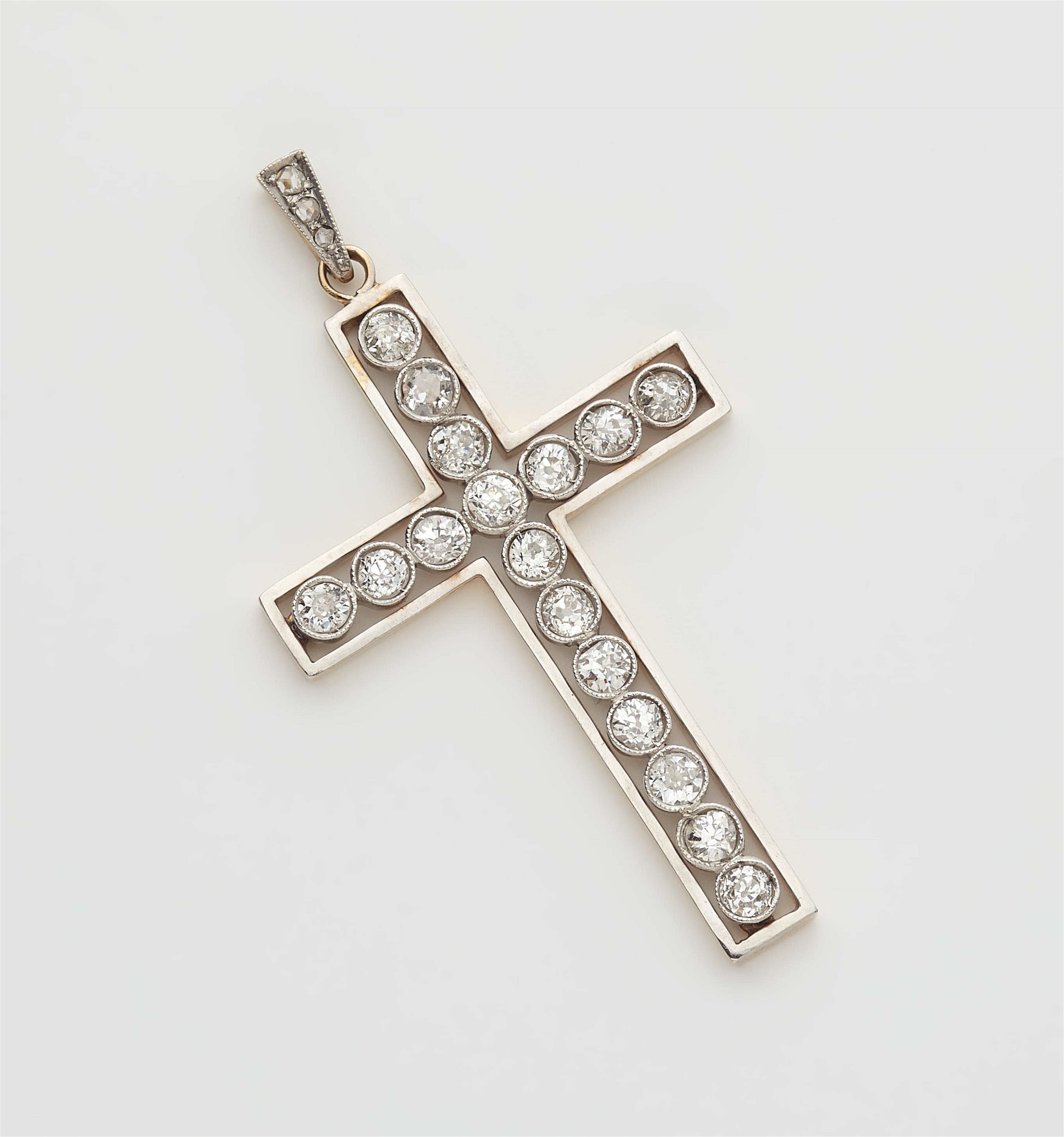 An 18k gold and diamond cross pendant. - image-1