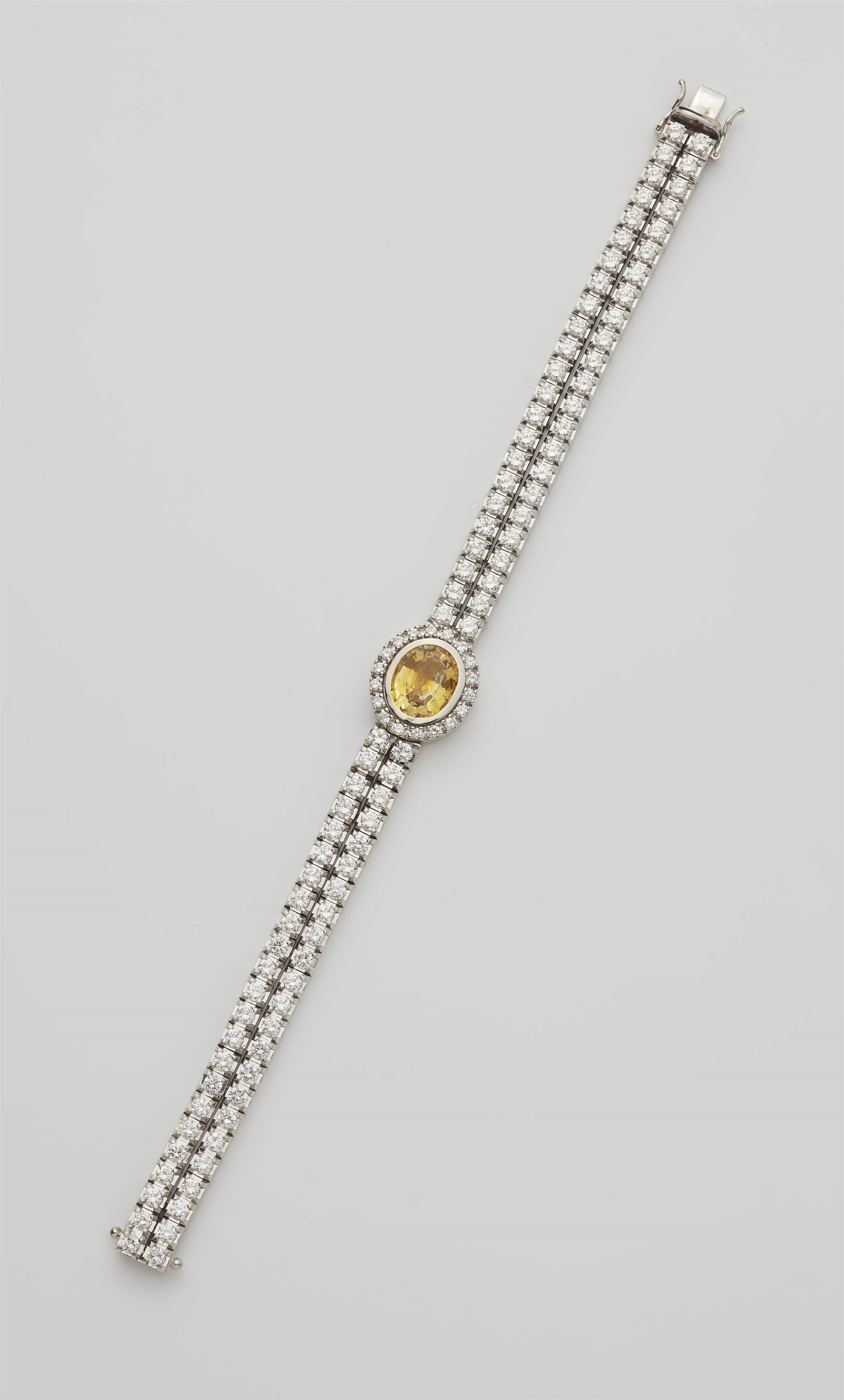 An 18k gold diamond and yellow sapphire bracelet (former cocktail watch). - image-1