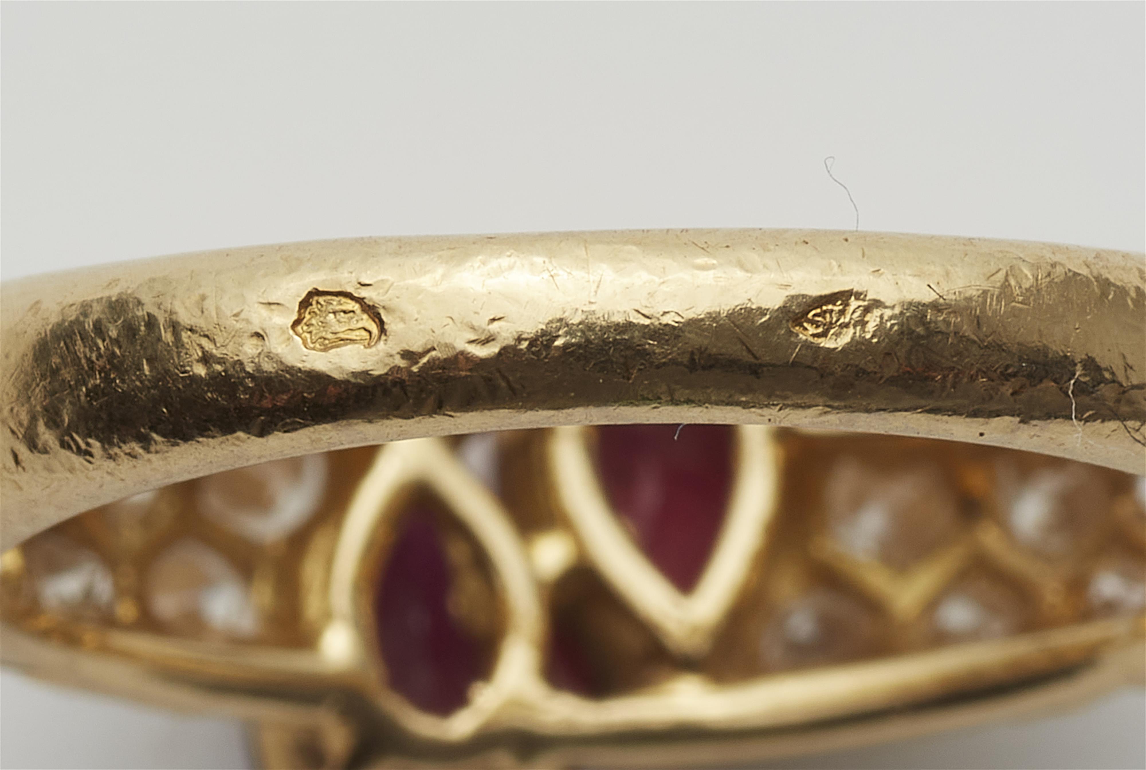 A French 18k gold diamond and pear-cut ruby band ring. - image-3