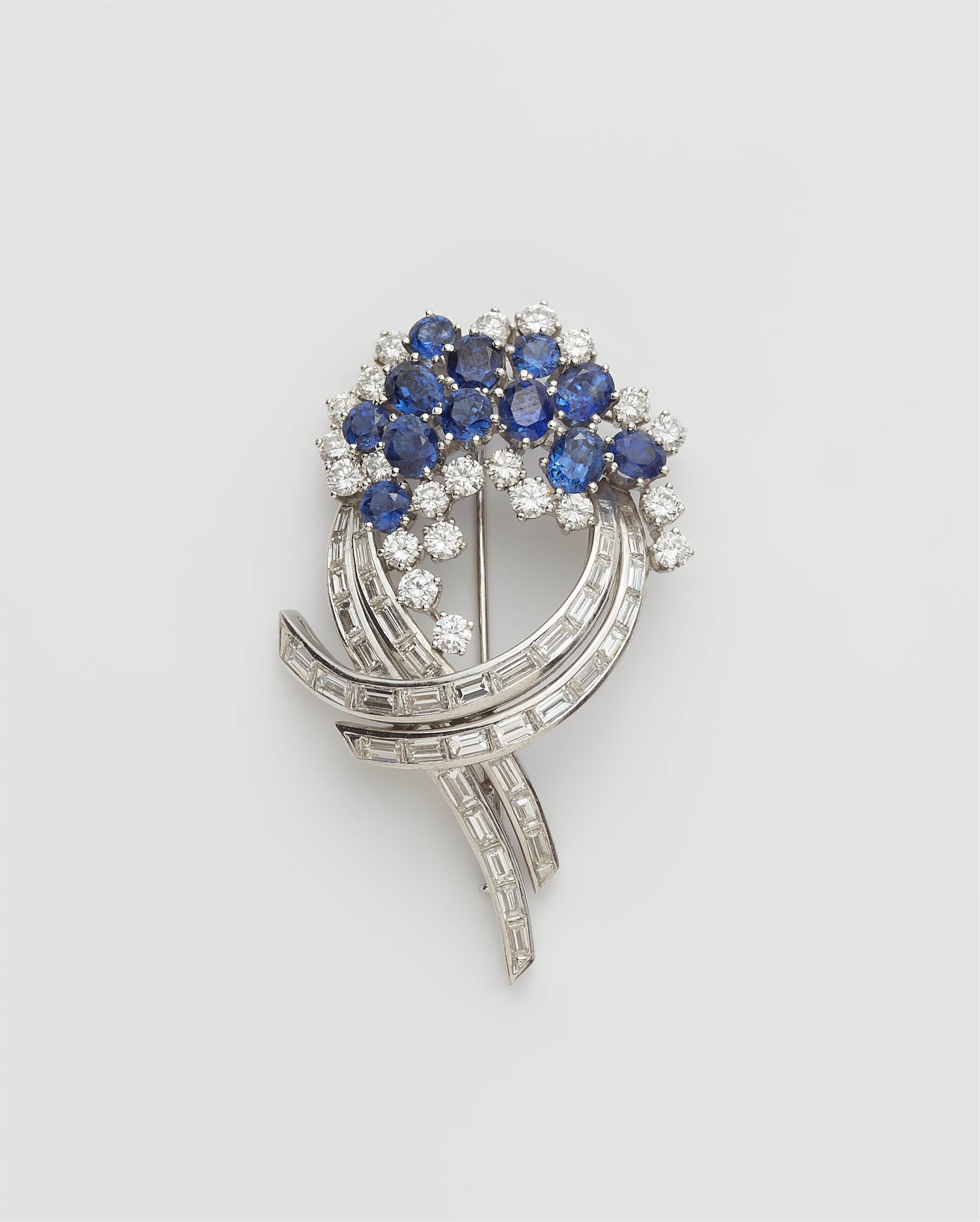 A German 18k white gold diamond and sapphire brooch. - image-1