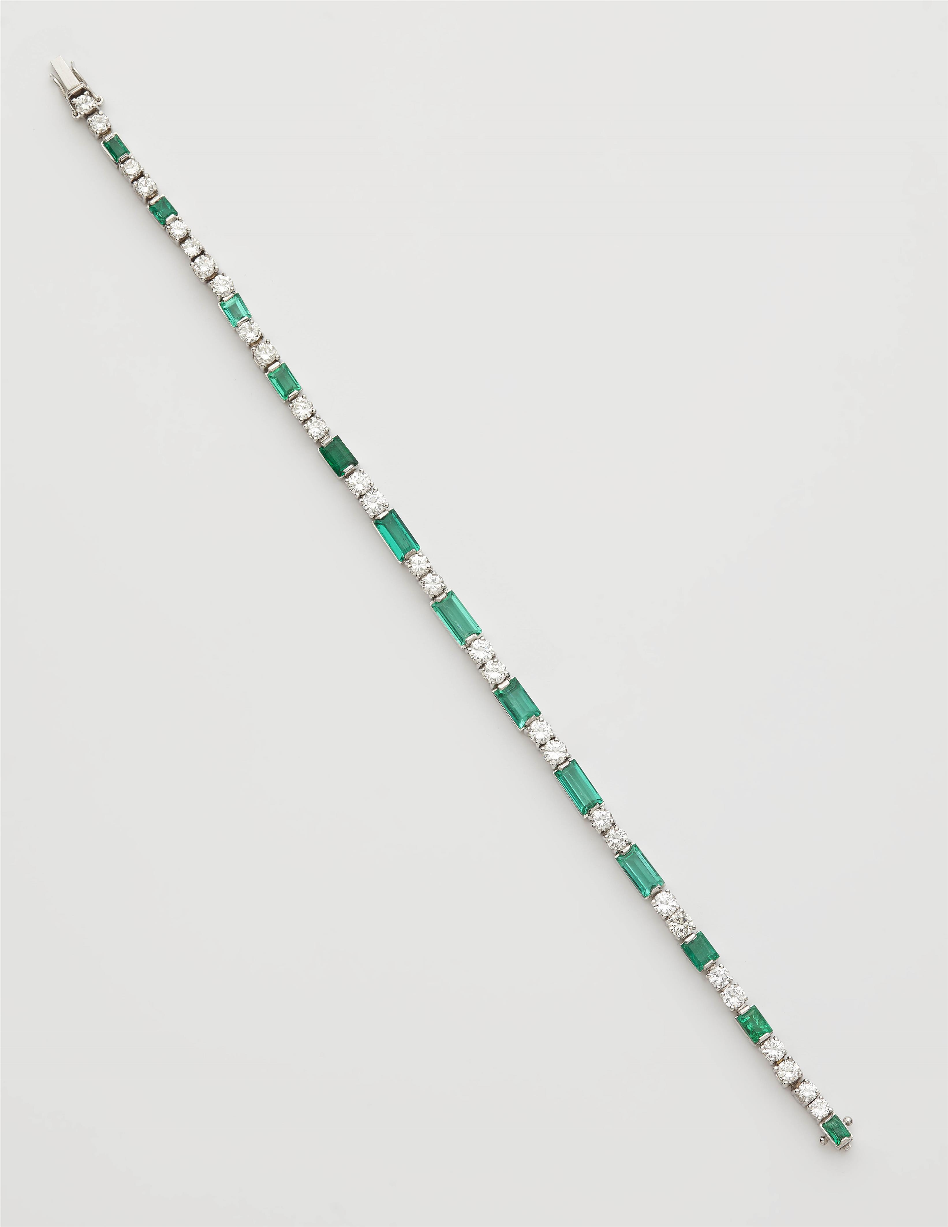 An 18k gold diamond and baguette-cut emerald bracelet. - image-1