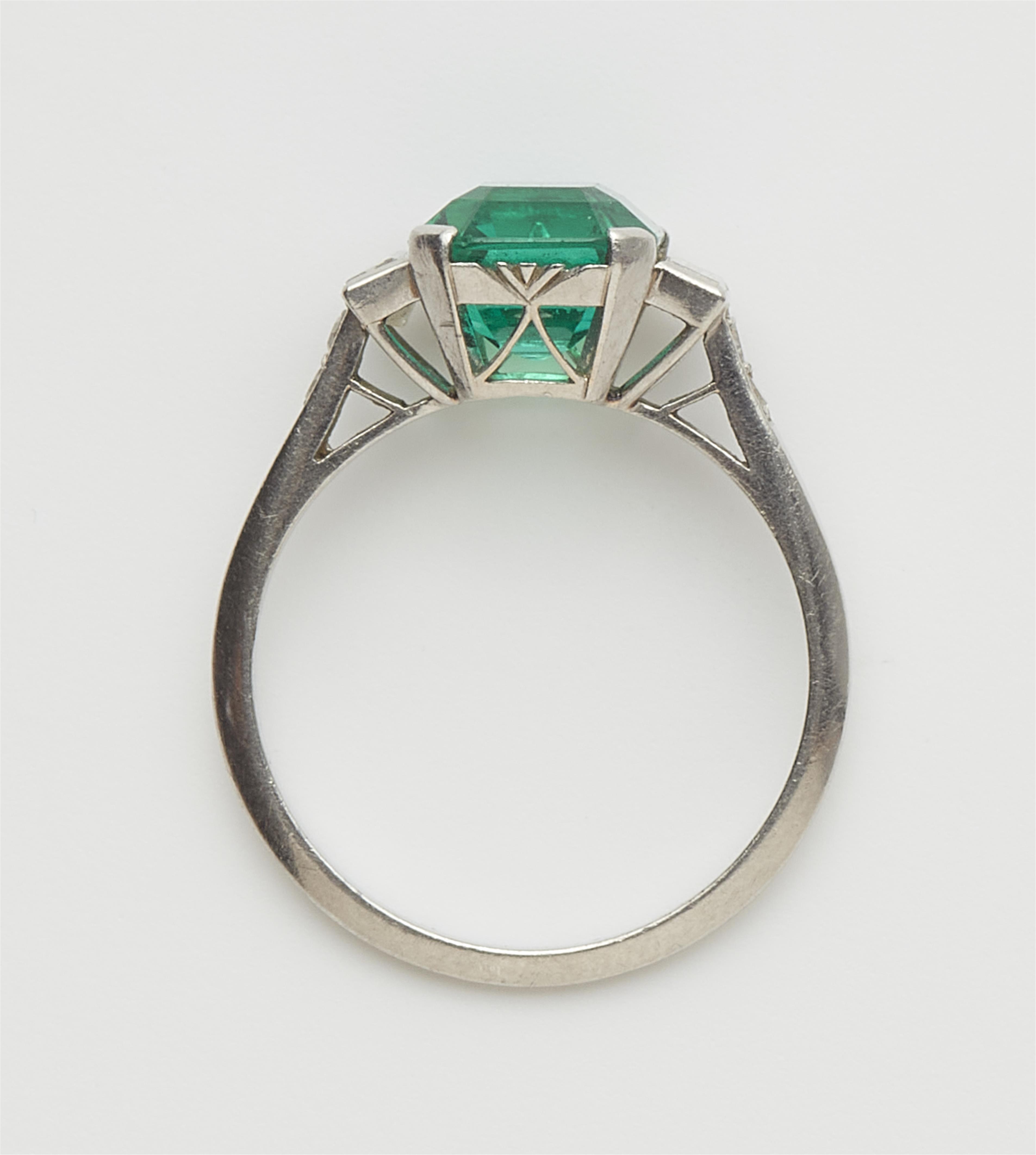 A platinum diamond and fine Columbian emerald ring. - image-2
