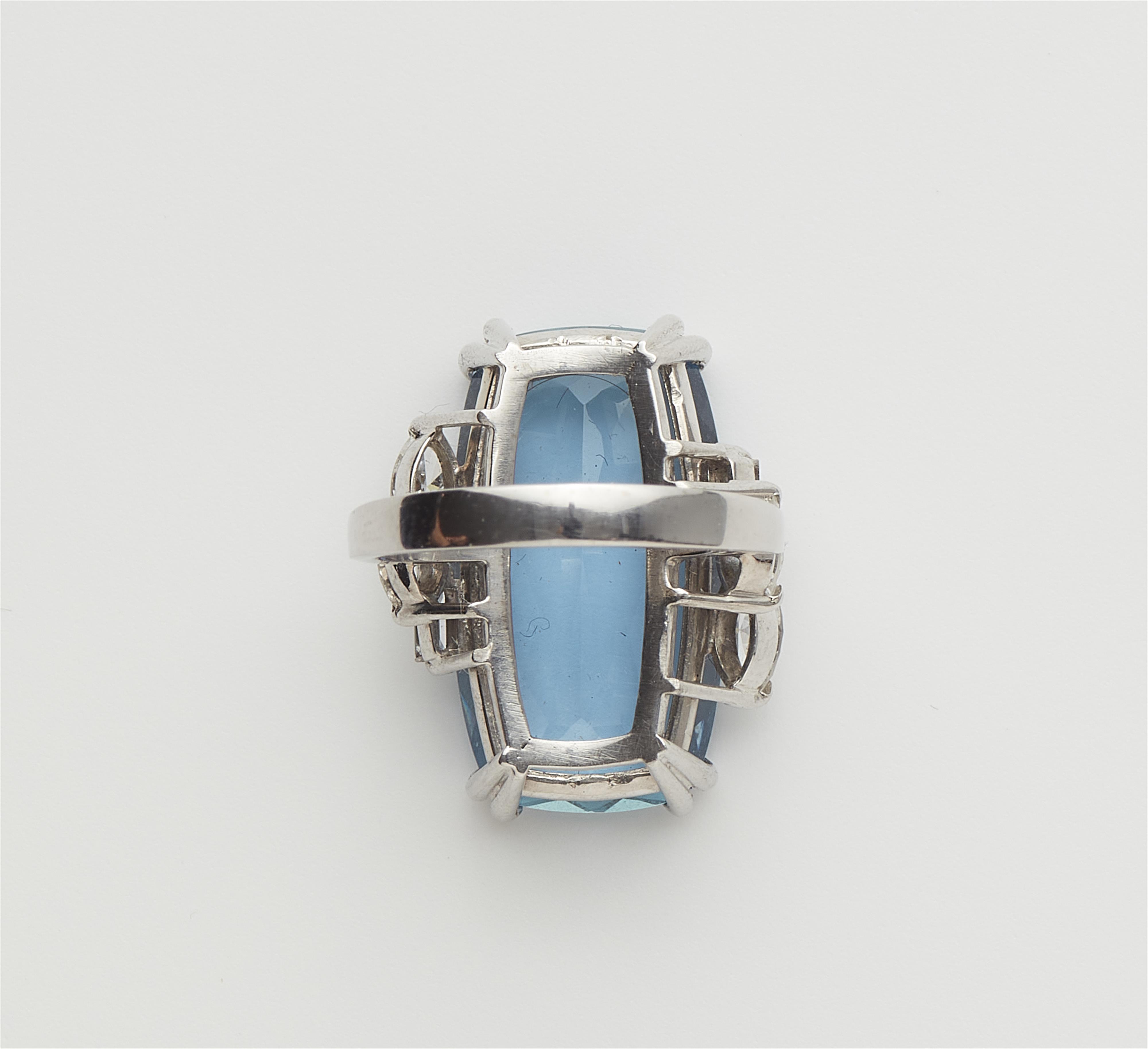An 18k gold diamond and ca. 10.50 ct aquamarine cocktail ring. - image-3