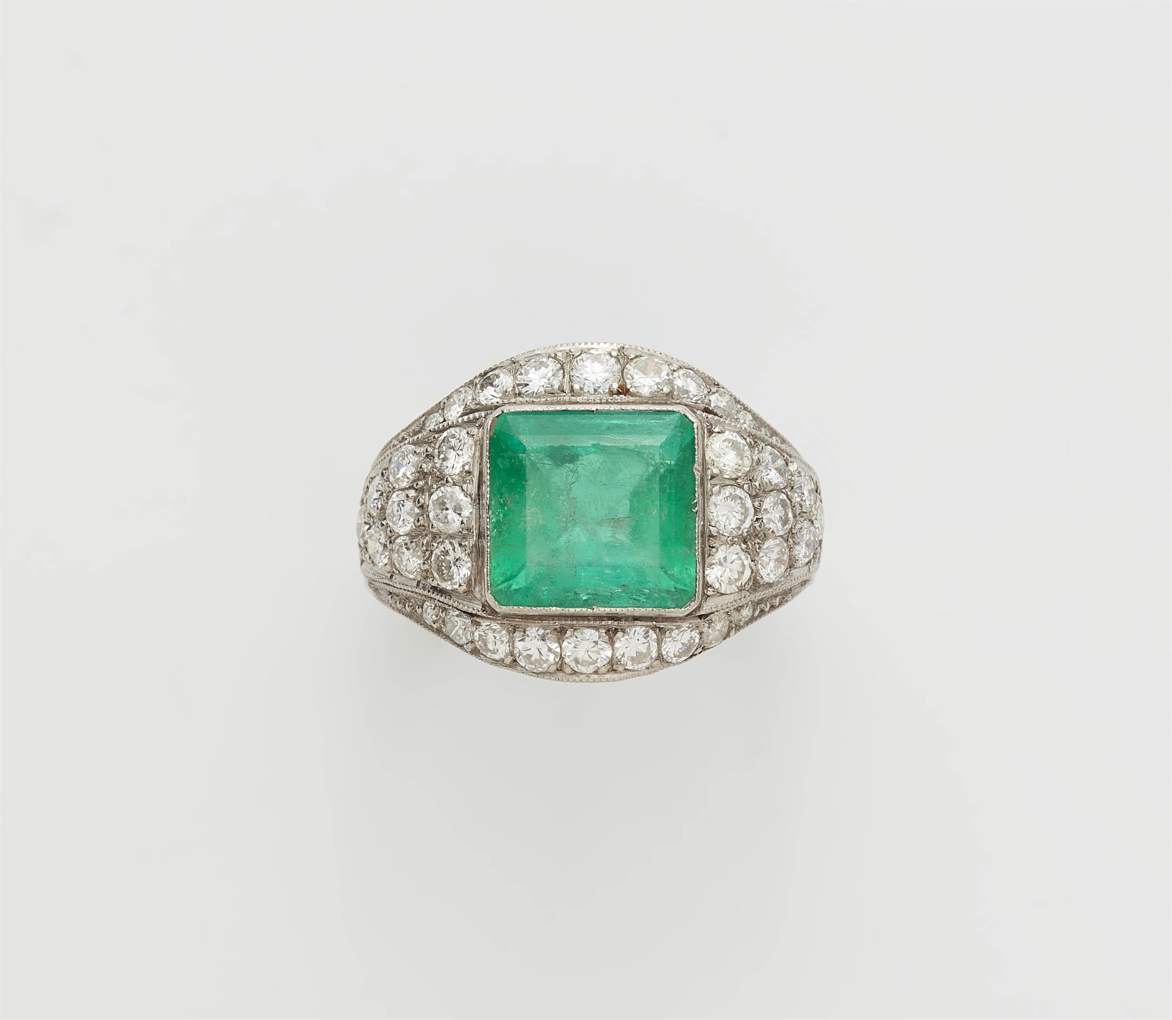 A platinum diamond and carré-cut emerald ring. - image-1