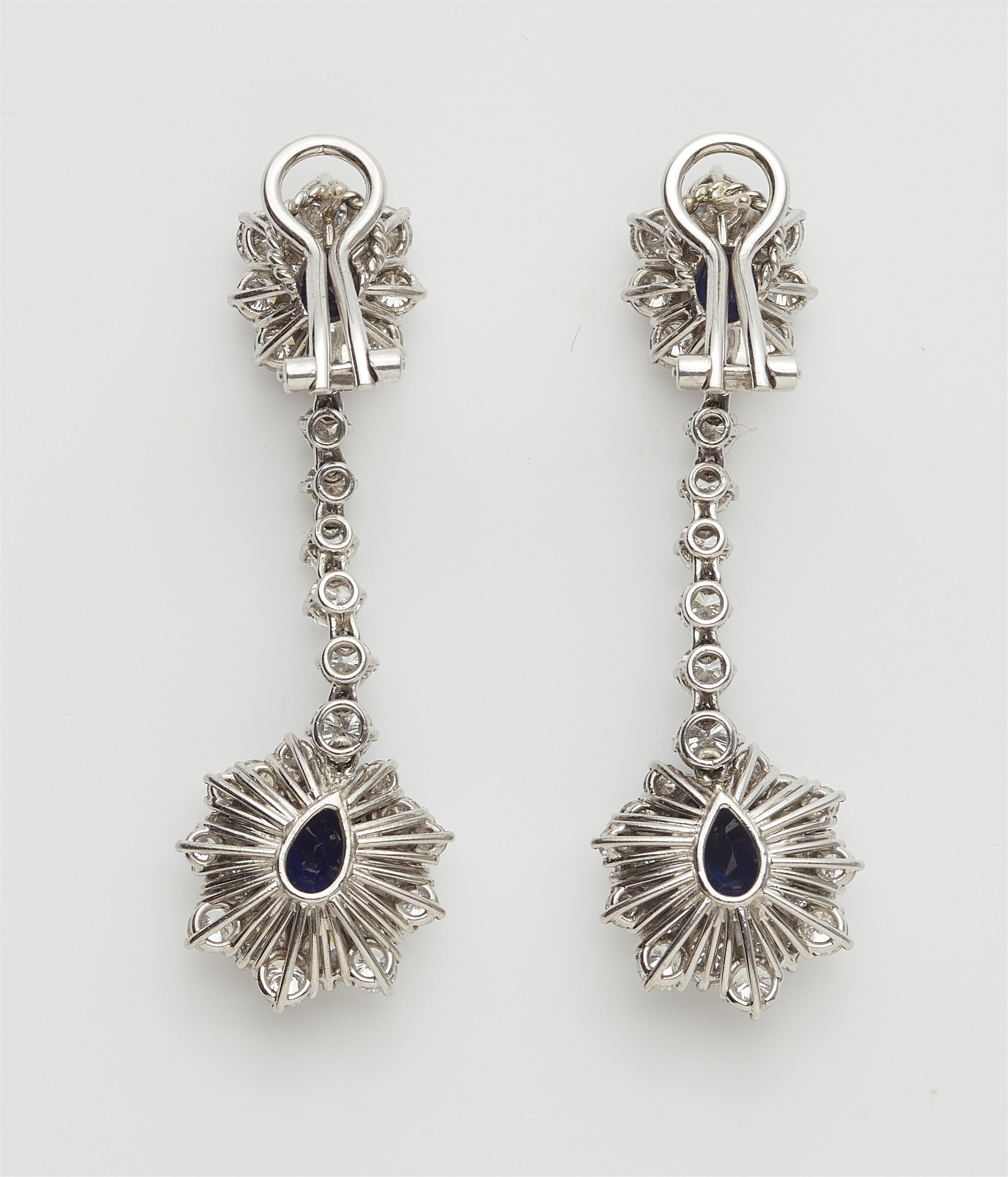 A pair of German 18k white gold diamond and sapphire pendant earrings with stud-clip mount. - image-2