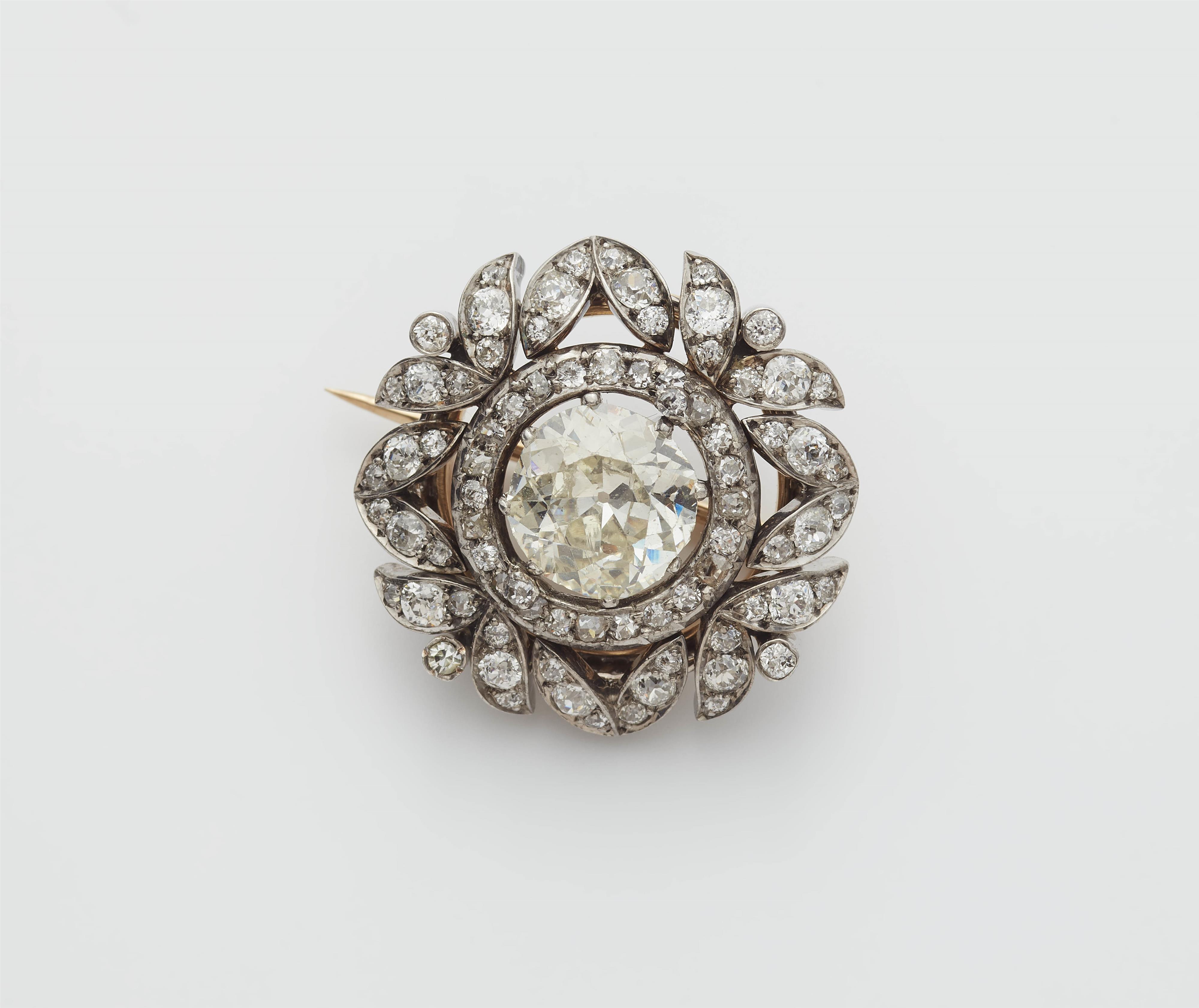 A Viennese 14k gold diamond brooch with a ca. 3.23 ct European old-cut centre stone. - image-1