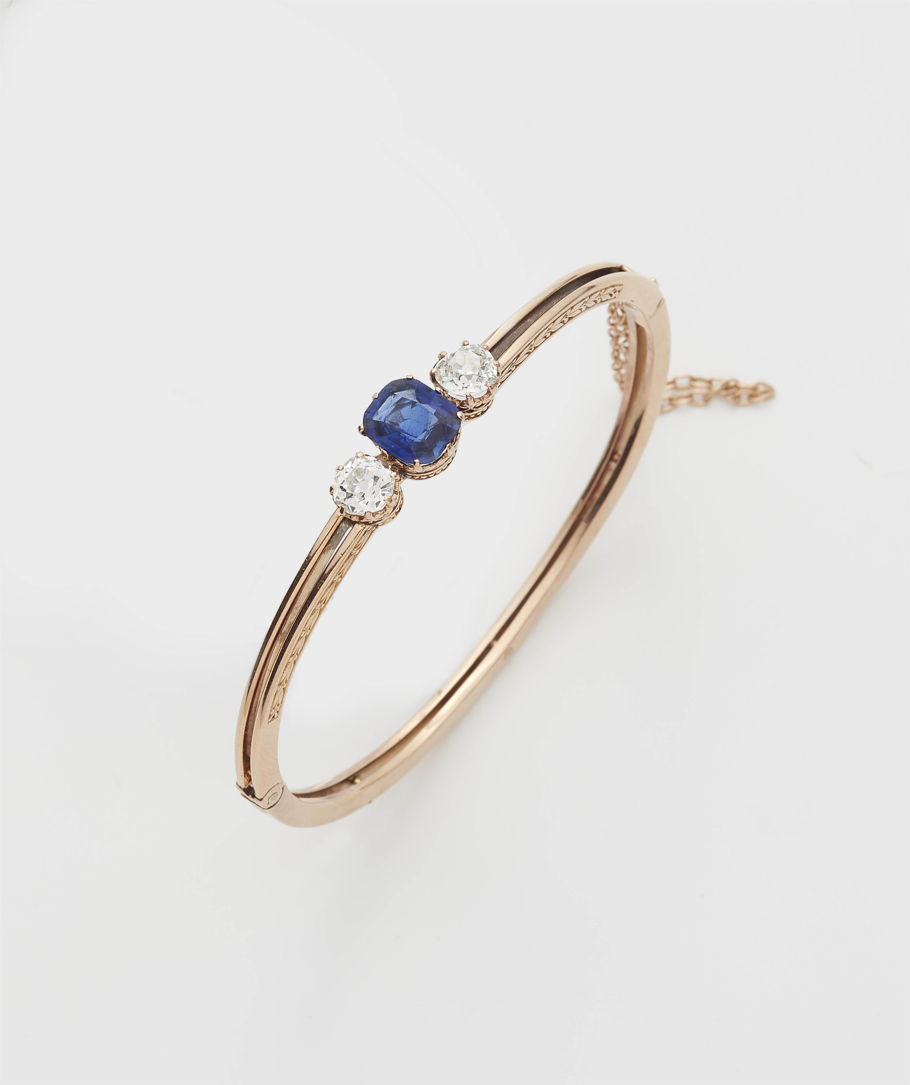 A Belle Epoque 14k rose gold, diamond and sapphire bangle. - image-1