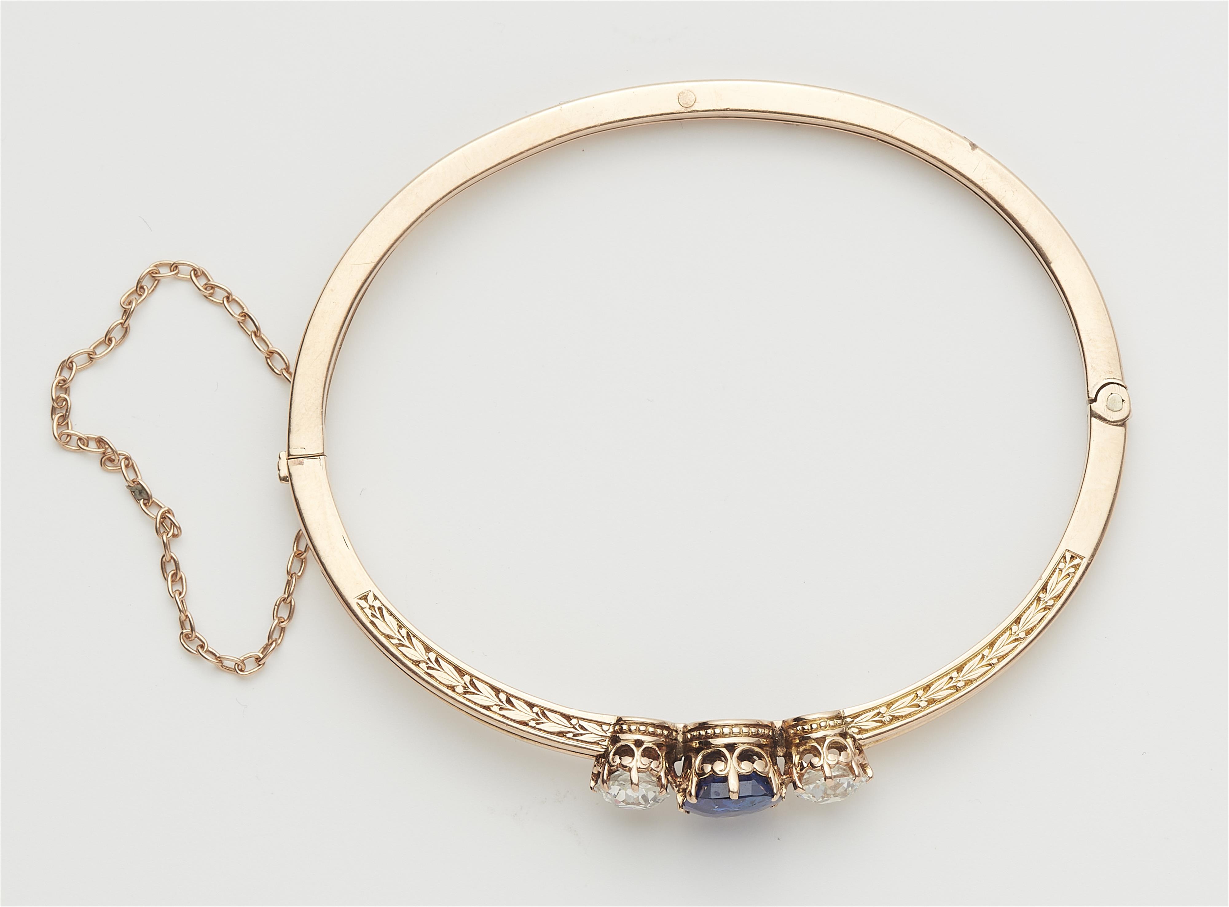 A Belle Epoque 14k rose gold, diamond and sapphire bangle. - image-3