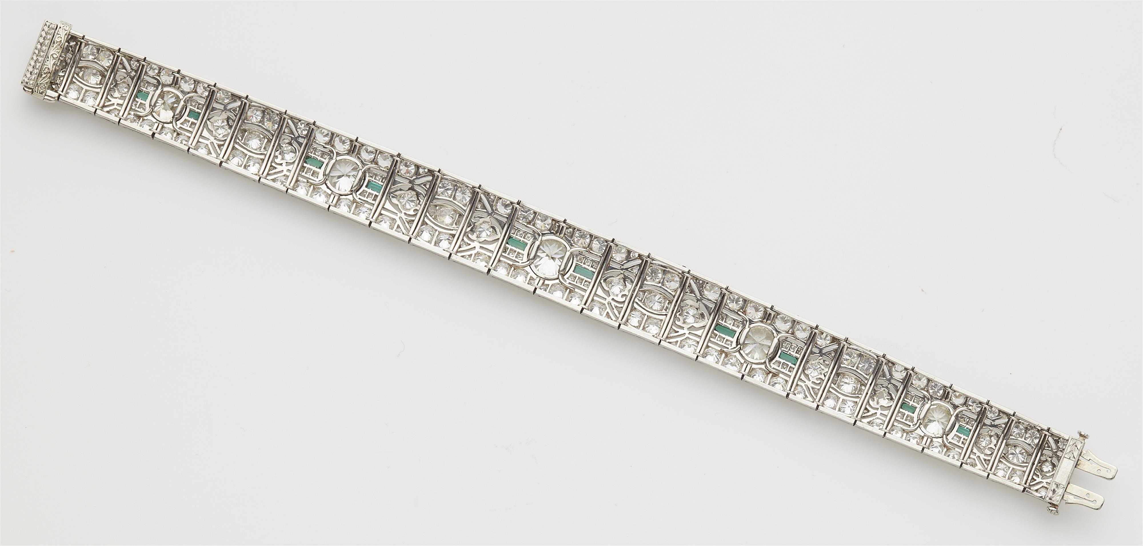 An Art Déco platinum diamond and emerald bracelet. - image-3