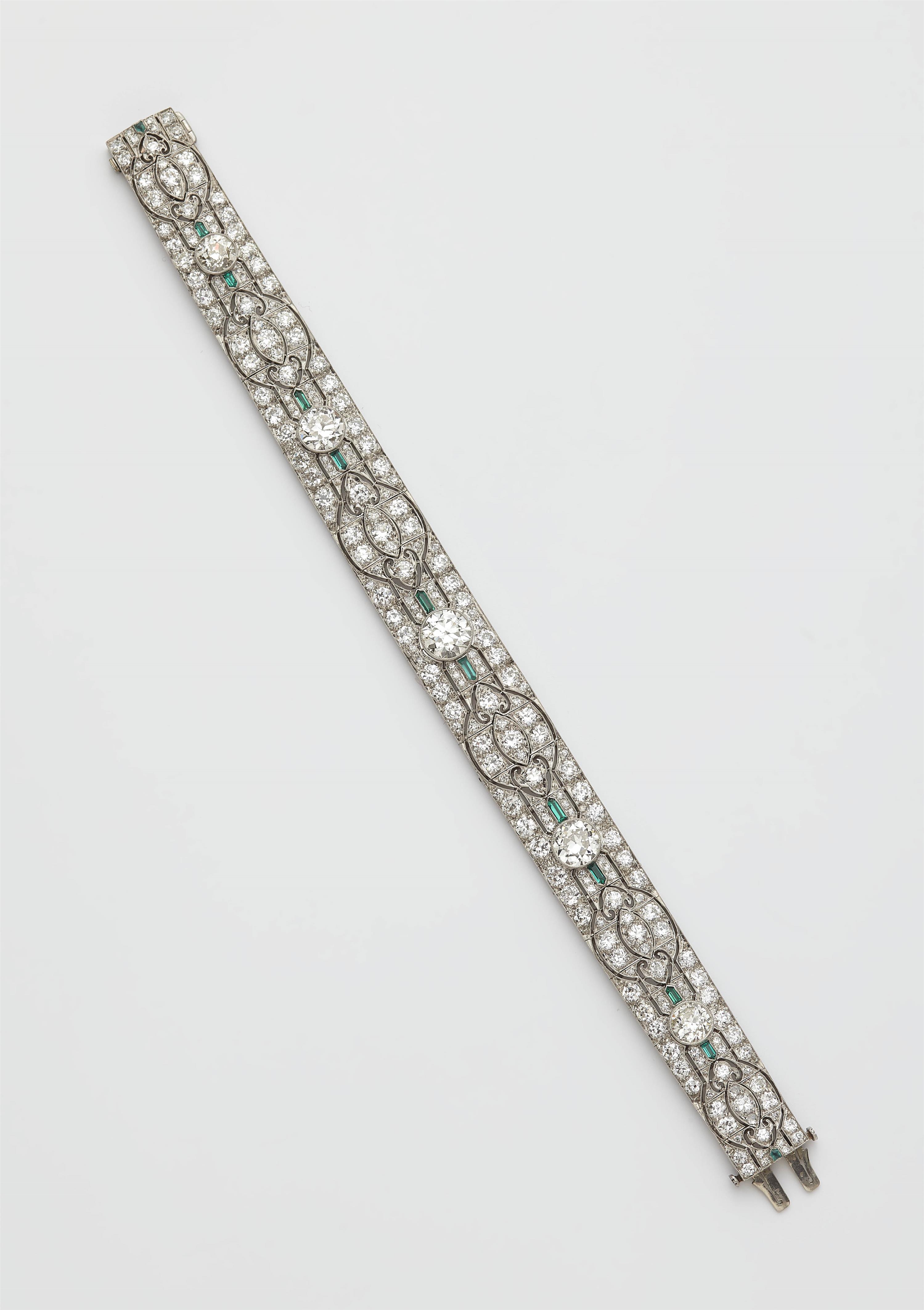 An Art Déco platinum diamond and emerald bracelet. - image-1