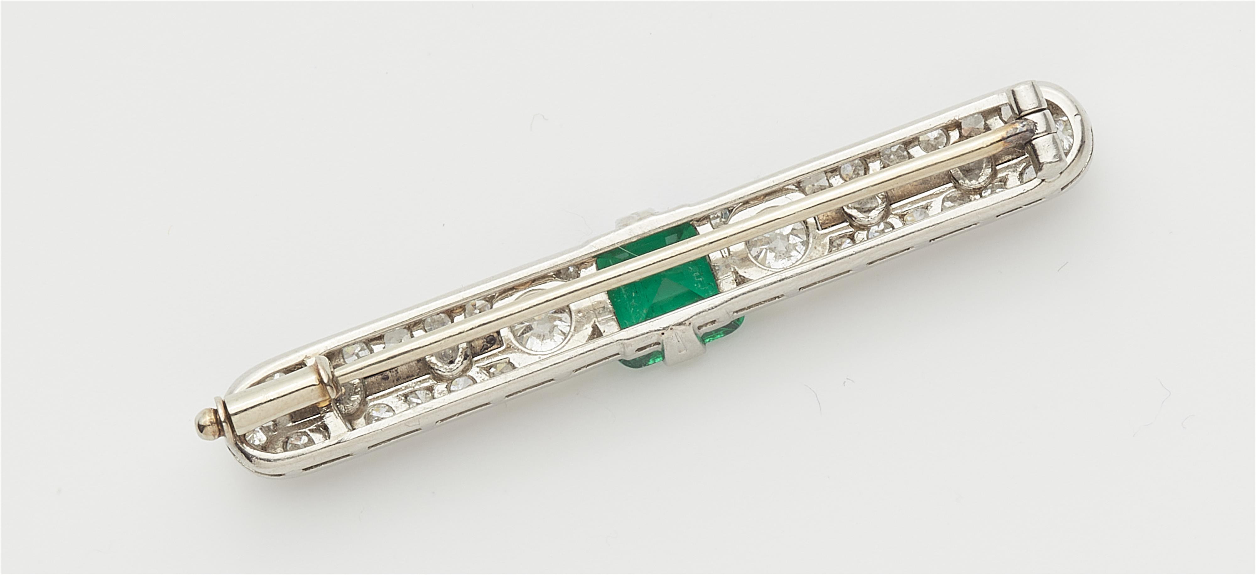 An Art Deco 18k gold diamond and emerald pin brooch. - image-2