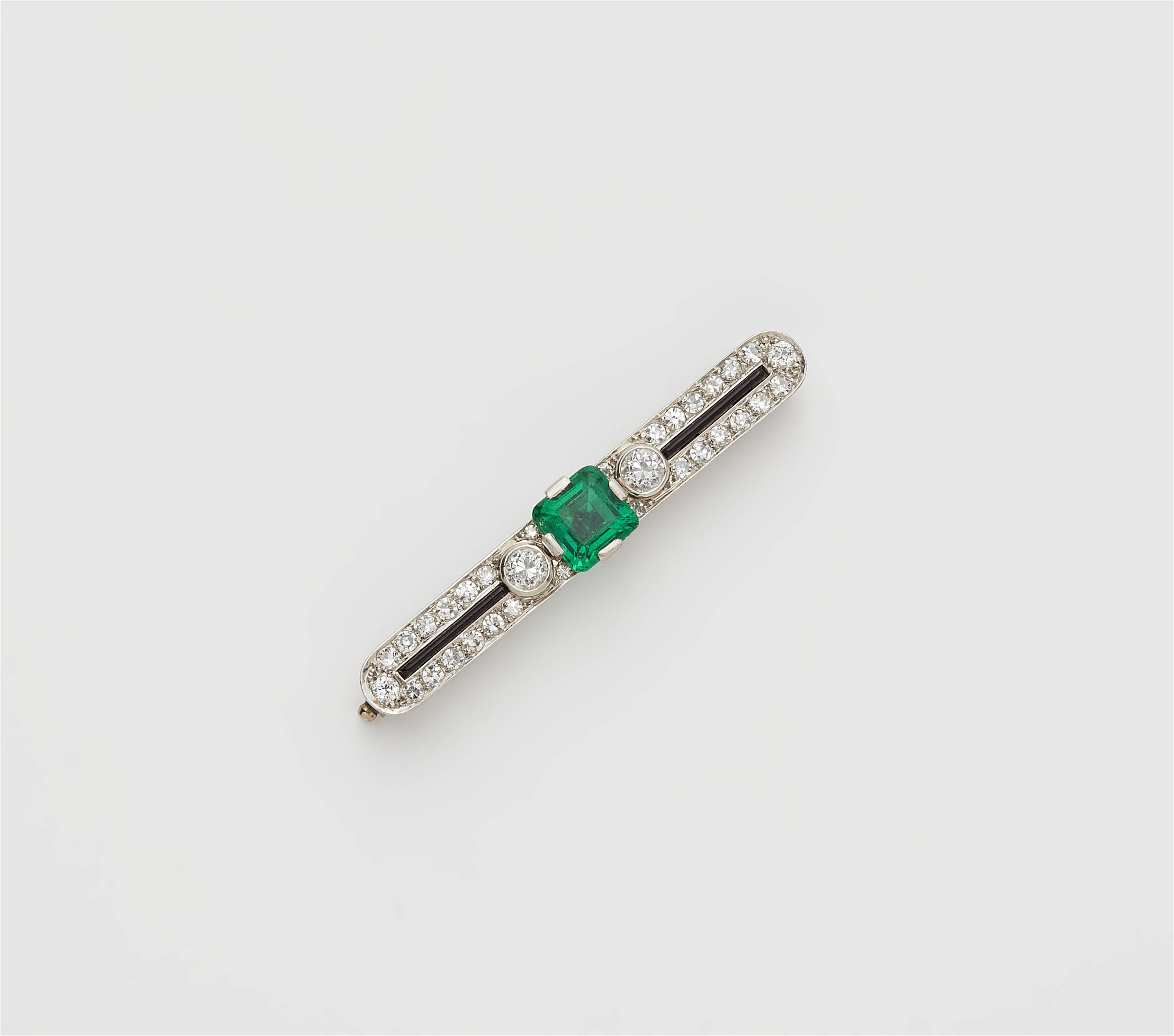 An Art Deco 18k gold diamond and emerald pin brooch. - image-1