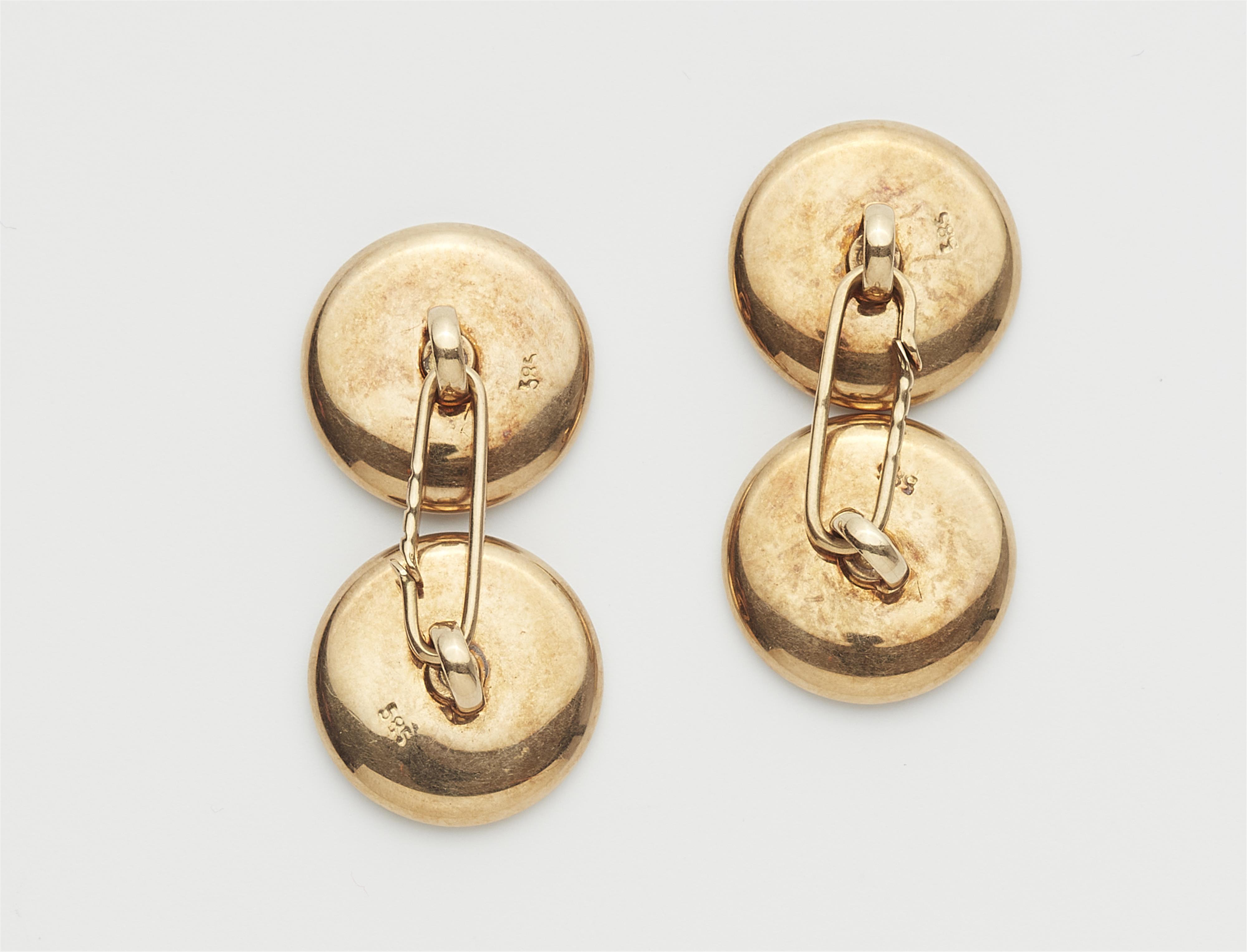 A pair of 14 kt gold, mother of pearl, onyx and diamond cufflinks. - image-2