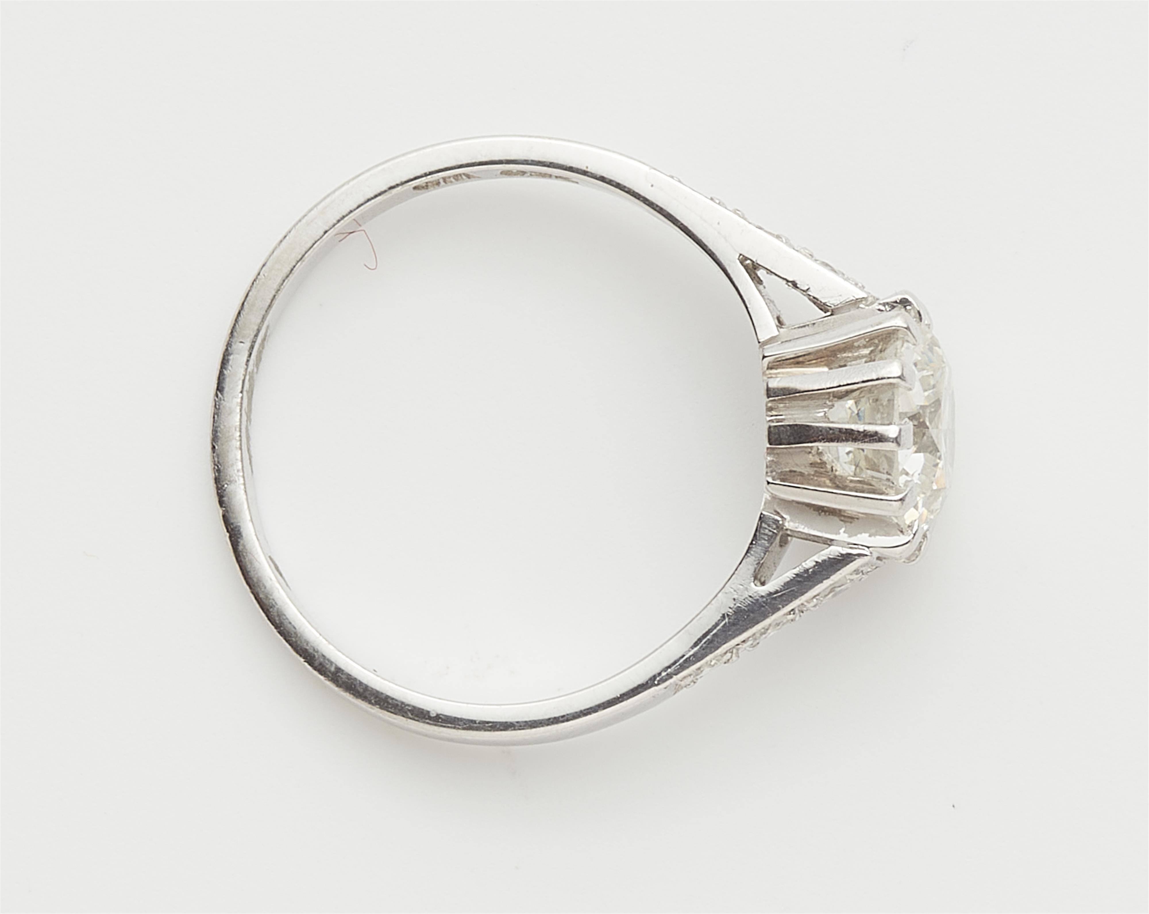 An 18k white gold and diamond solitaire ring. - image-2