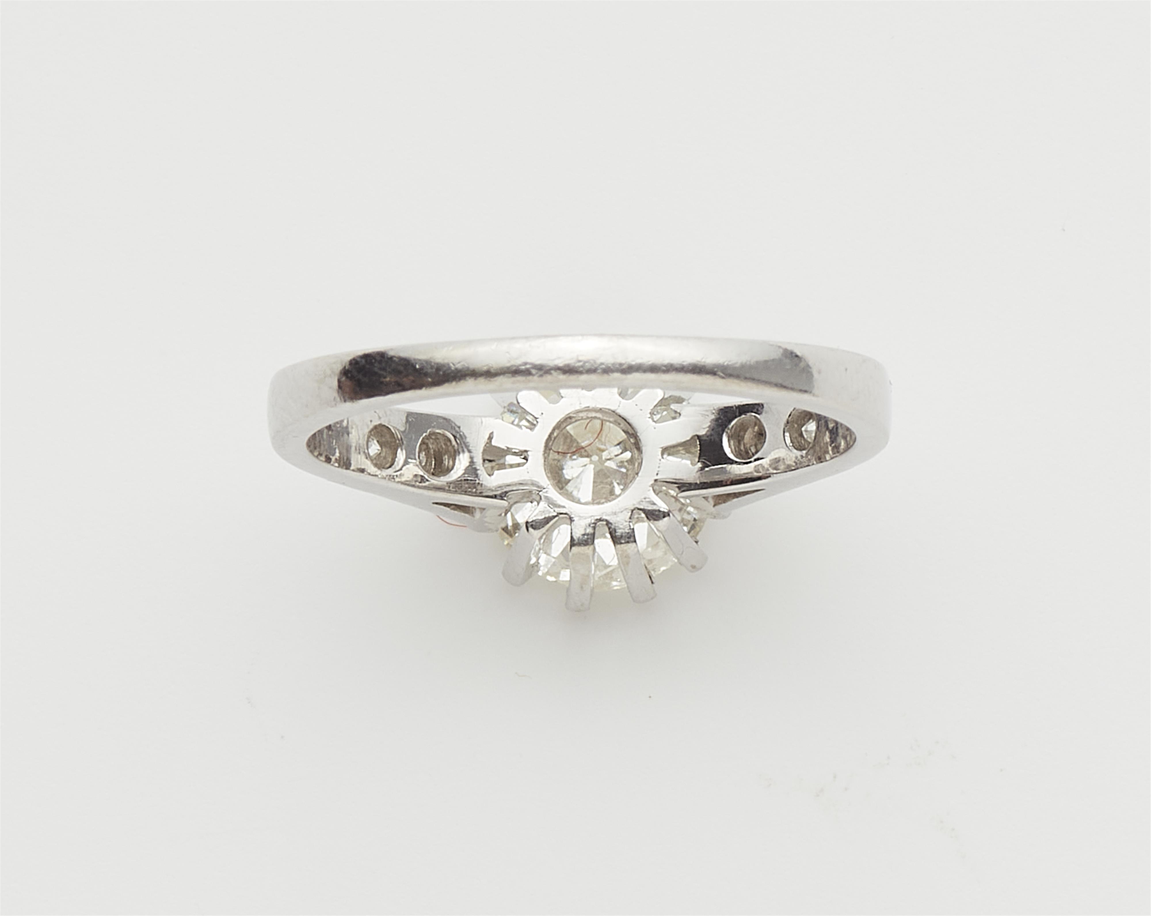 An 18k white gold and diamond solitaire ring. - image-3