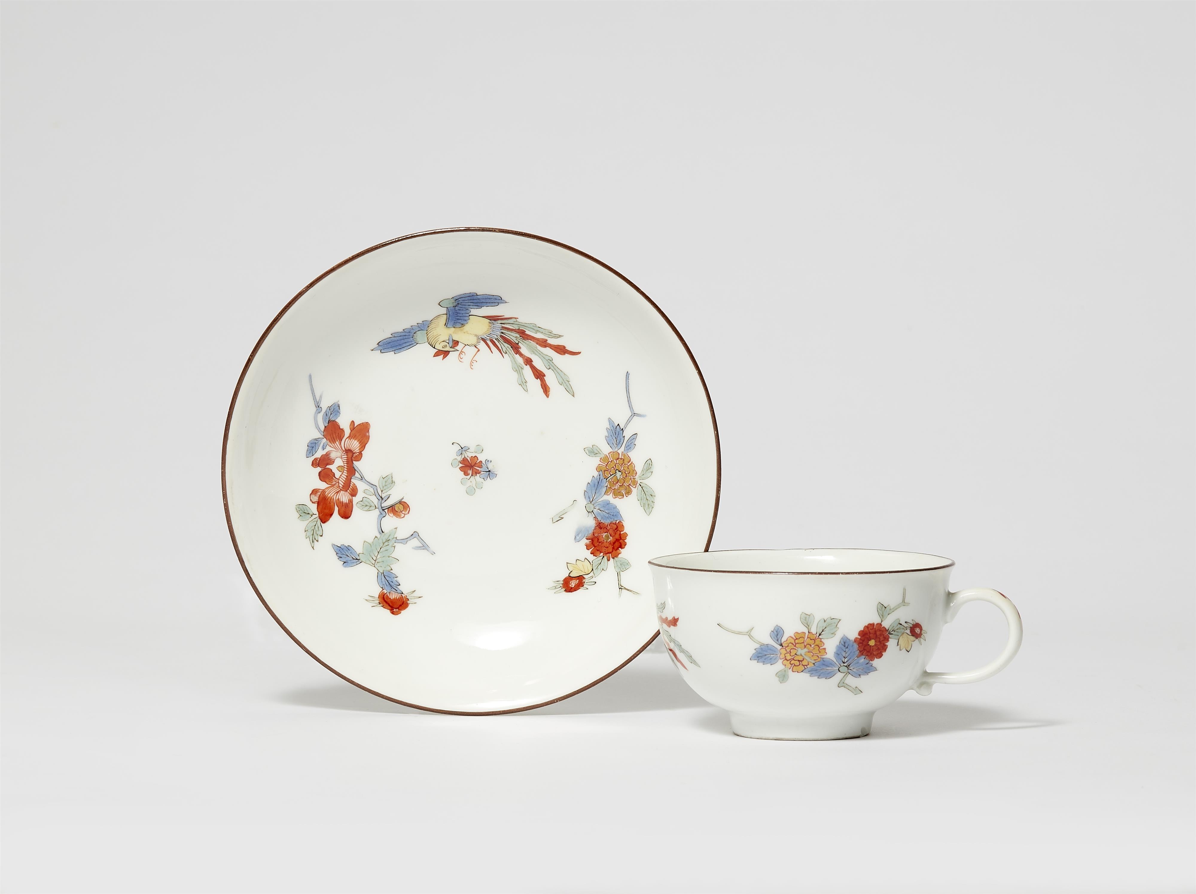 A Meissen porcelain cup and saucer with Hôô bird and chrysanthemum decor - image-1