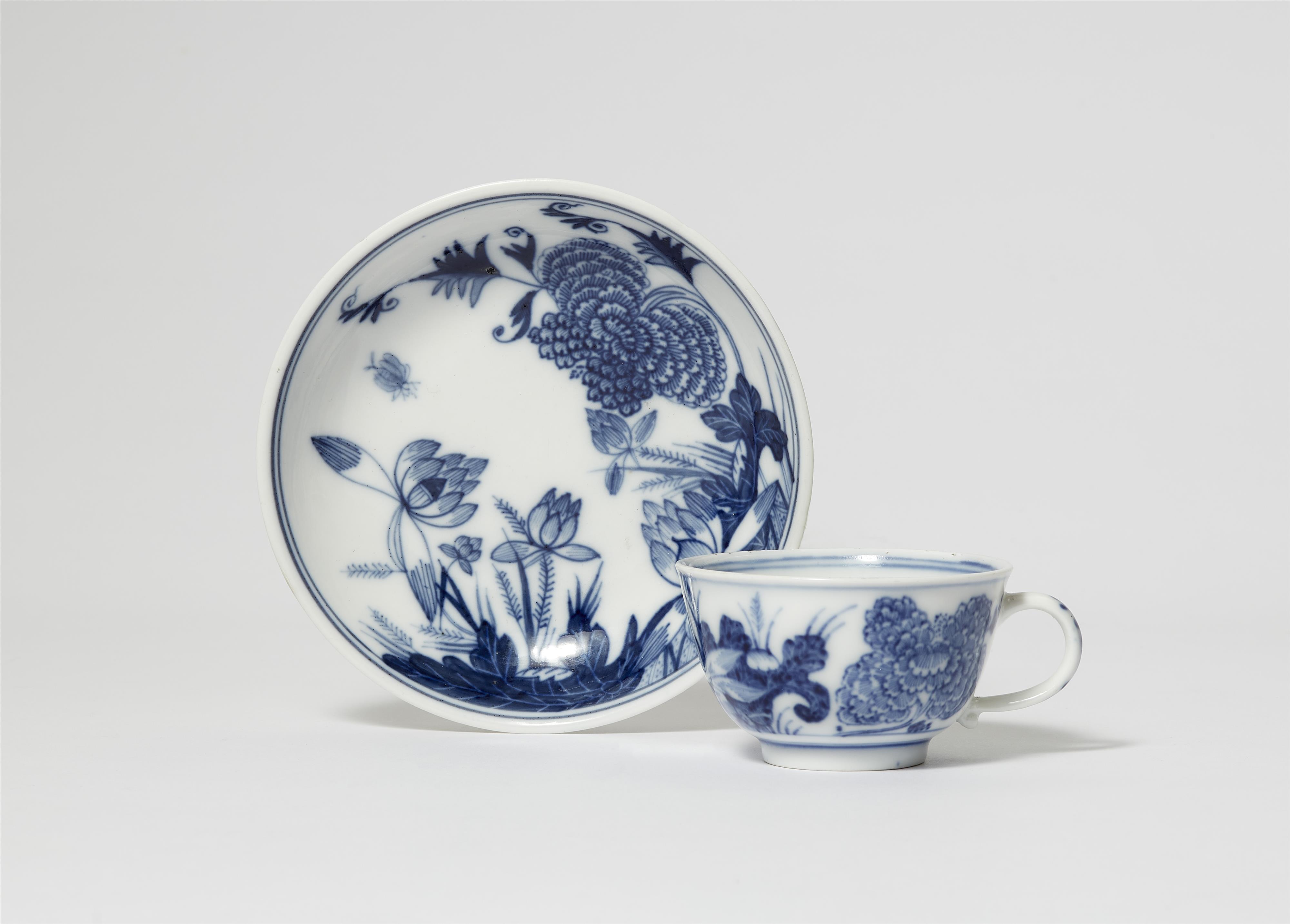 A Meissen porcelain cup and saucer with lotus flower and chrysanthemum designs - image-1