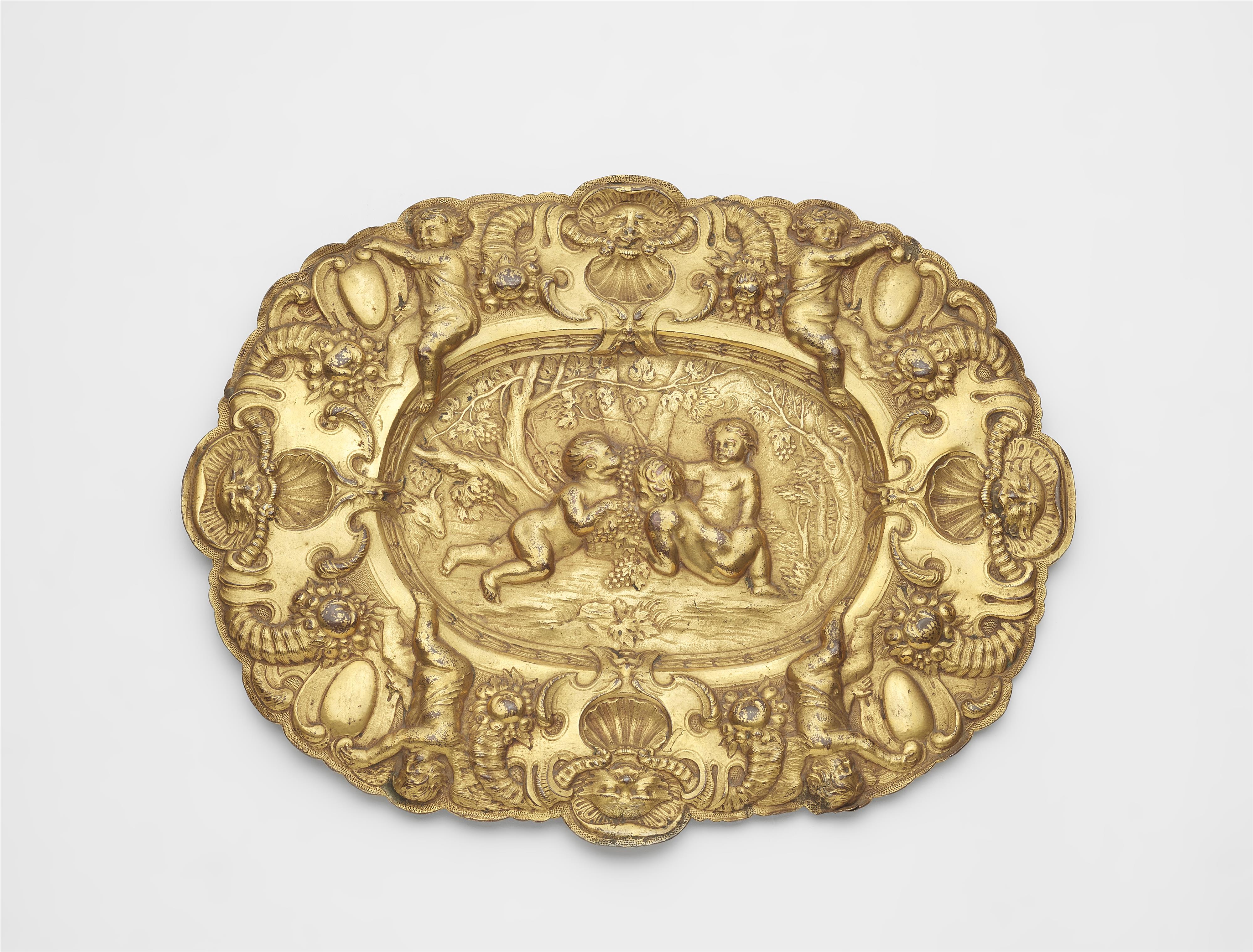 A gilt copper dish with putti as an allegory of autumn - image-1