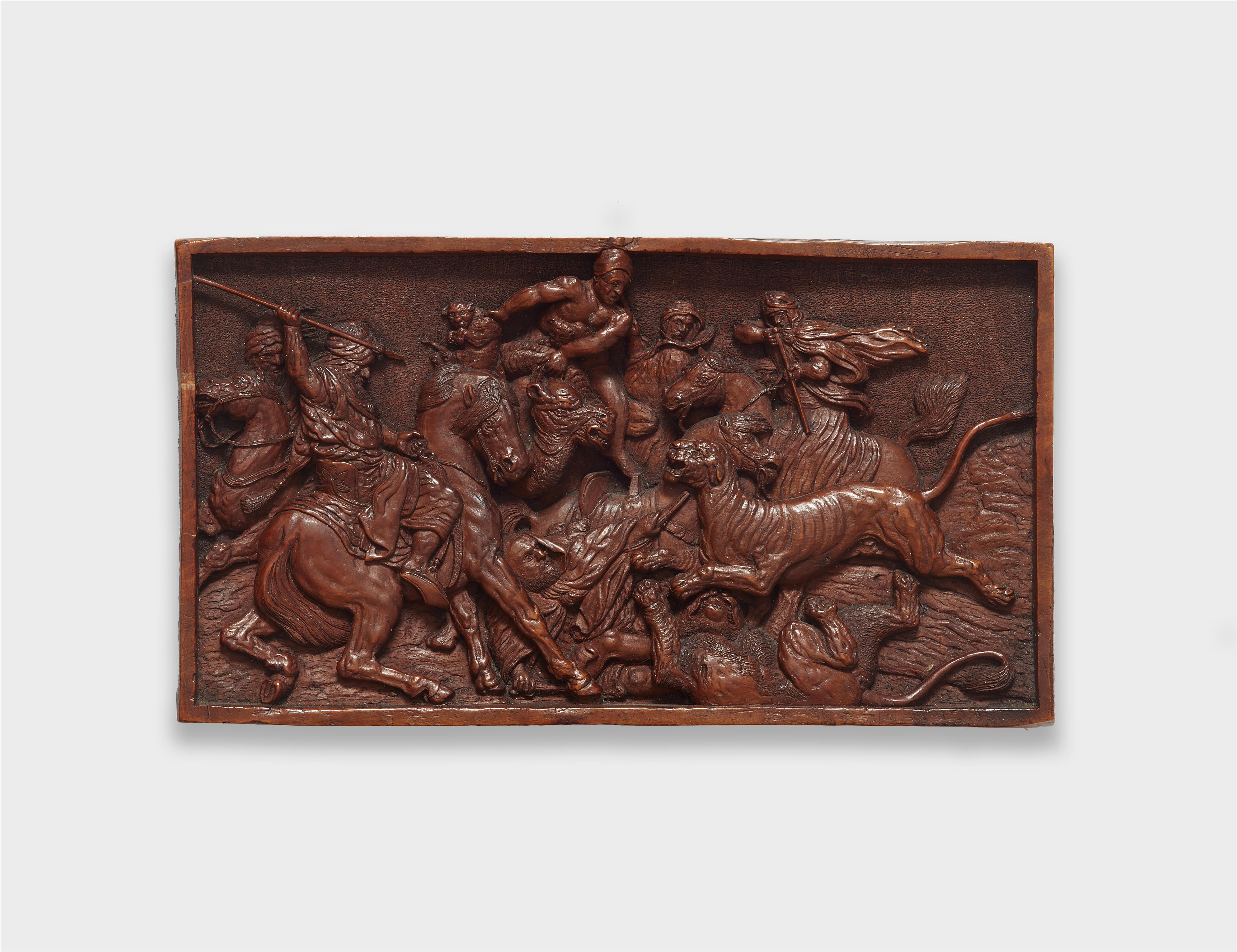 A carved walnut relief of a lion hunt - image-1