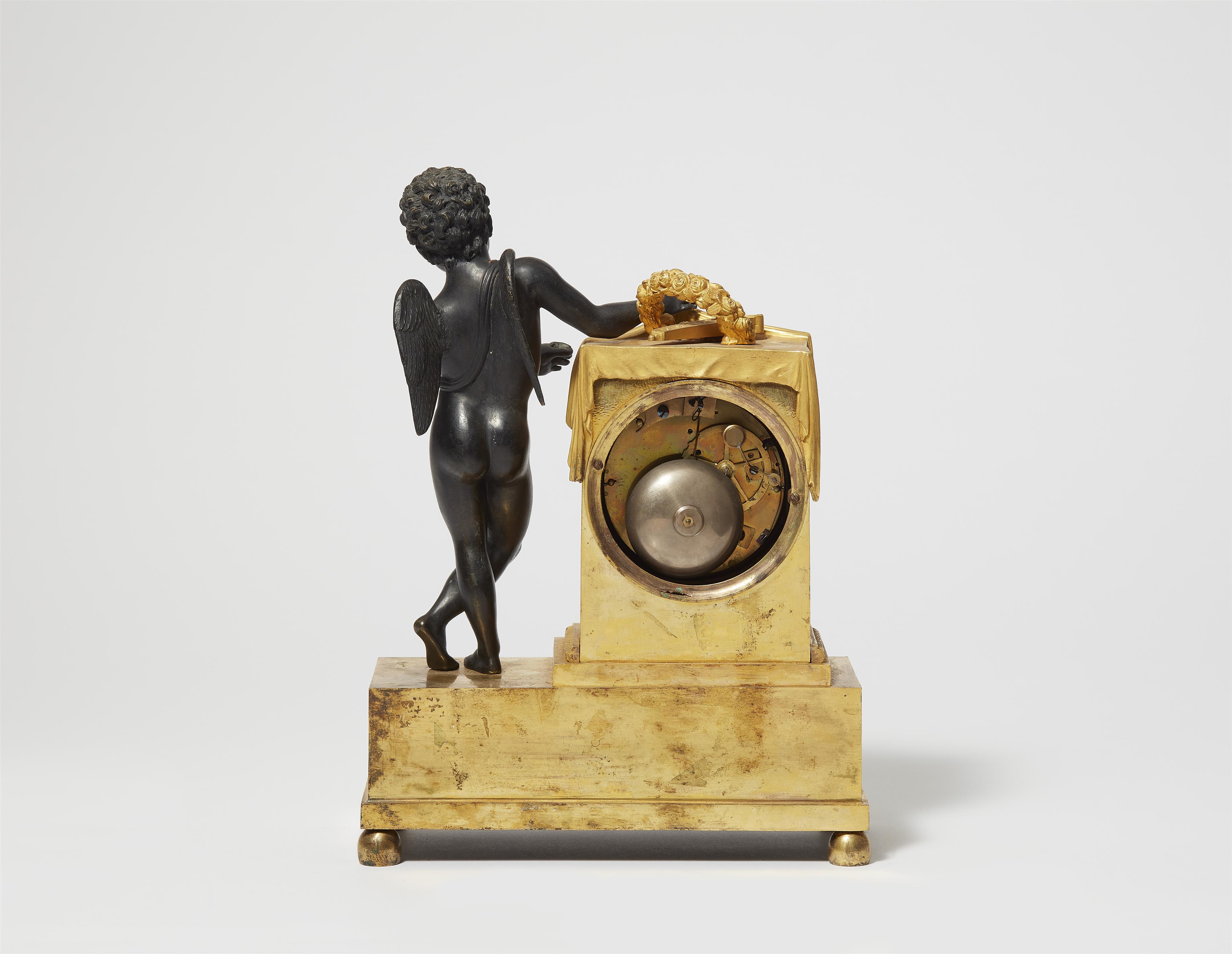 A Parisian gilt and patinated bronze pendulum clock with Cupid revealing time - image-2