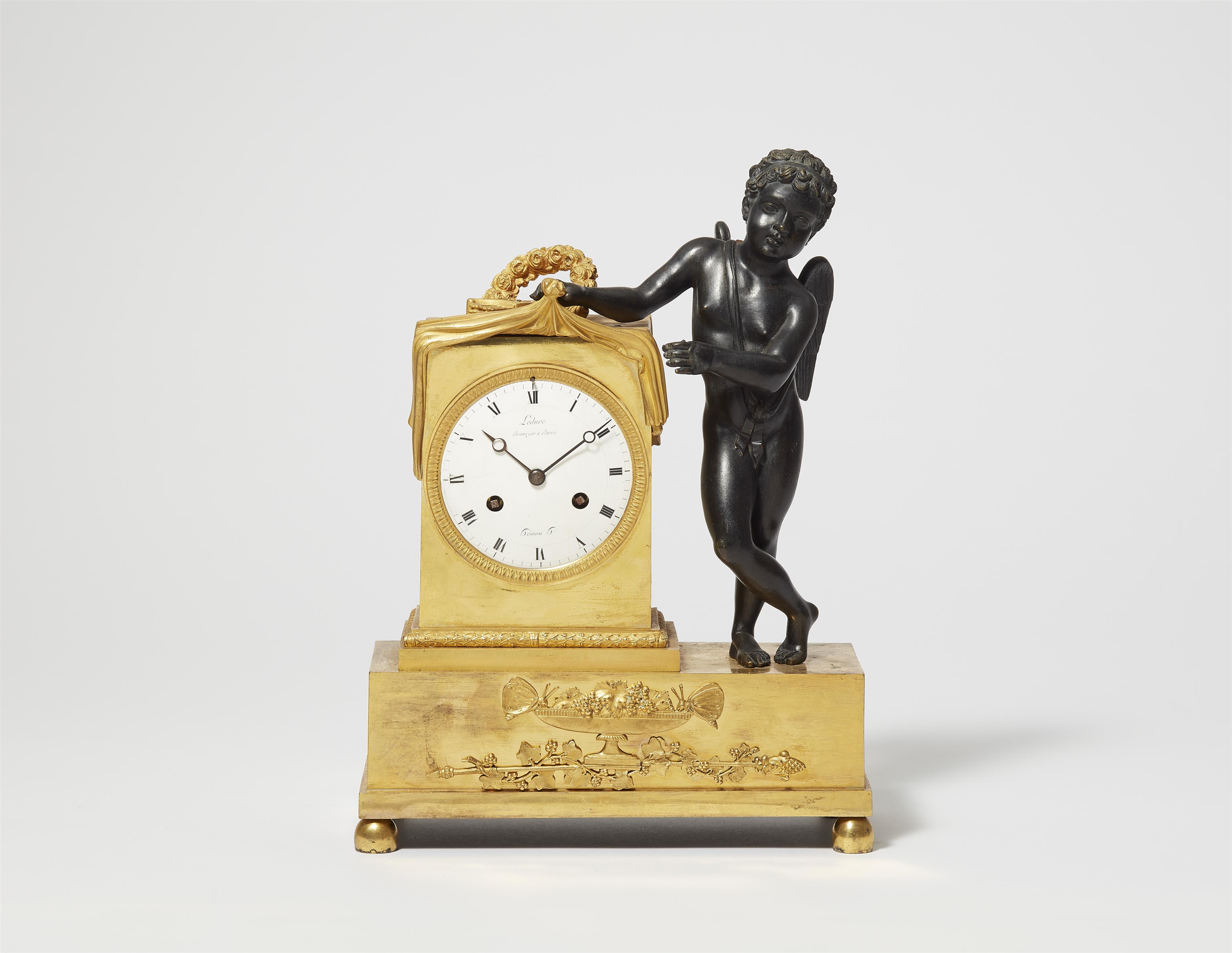 A Parisian gilt and patinated bronze pendulum clock with Cupid revealing time - image-1