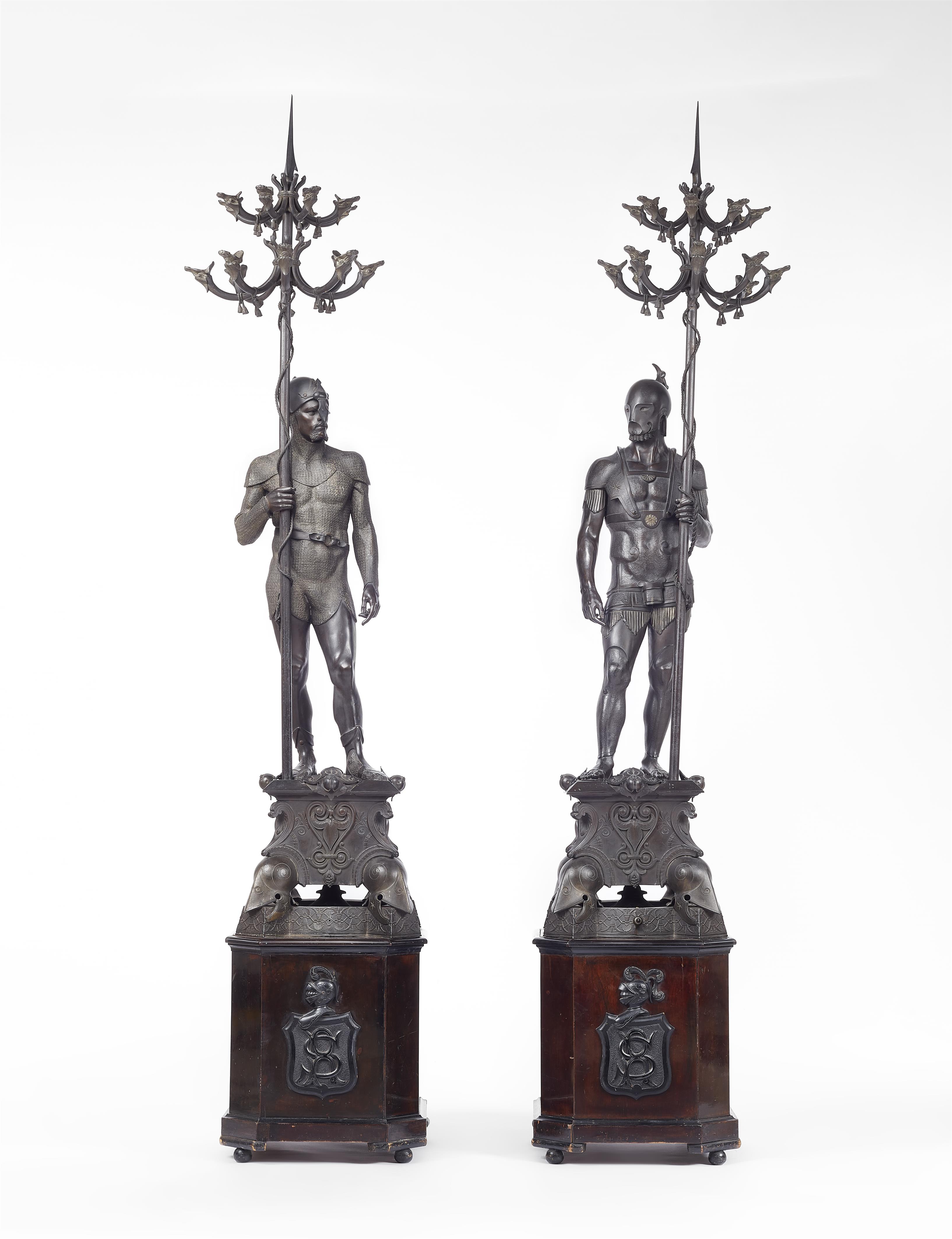 Two bronze figures of warriors holding candelabra - image-1