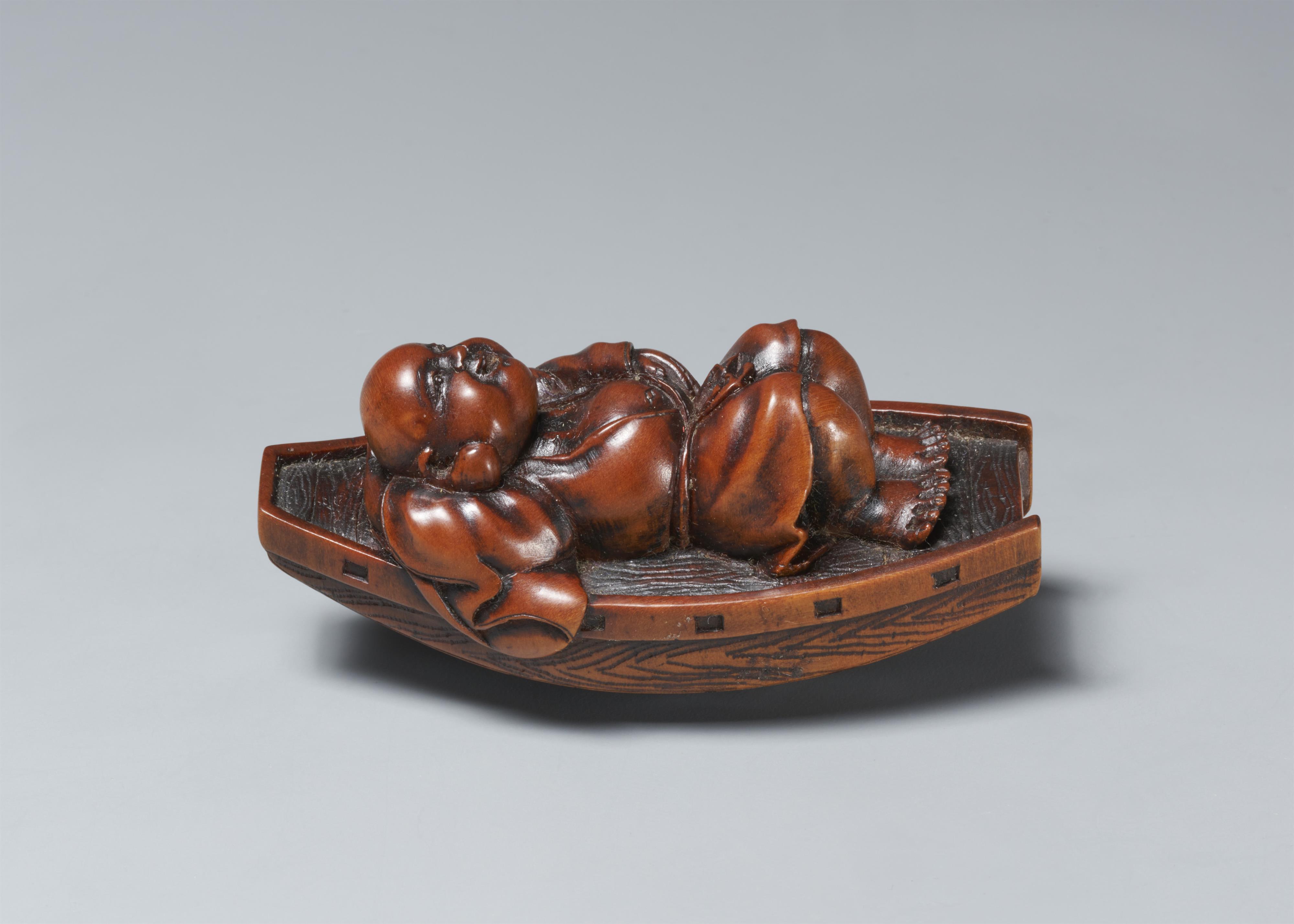 A boxwood netsuke of Hotei resting in a boat. Late 19th century - image-2