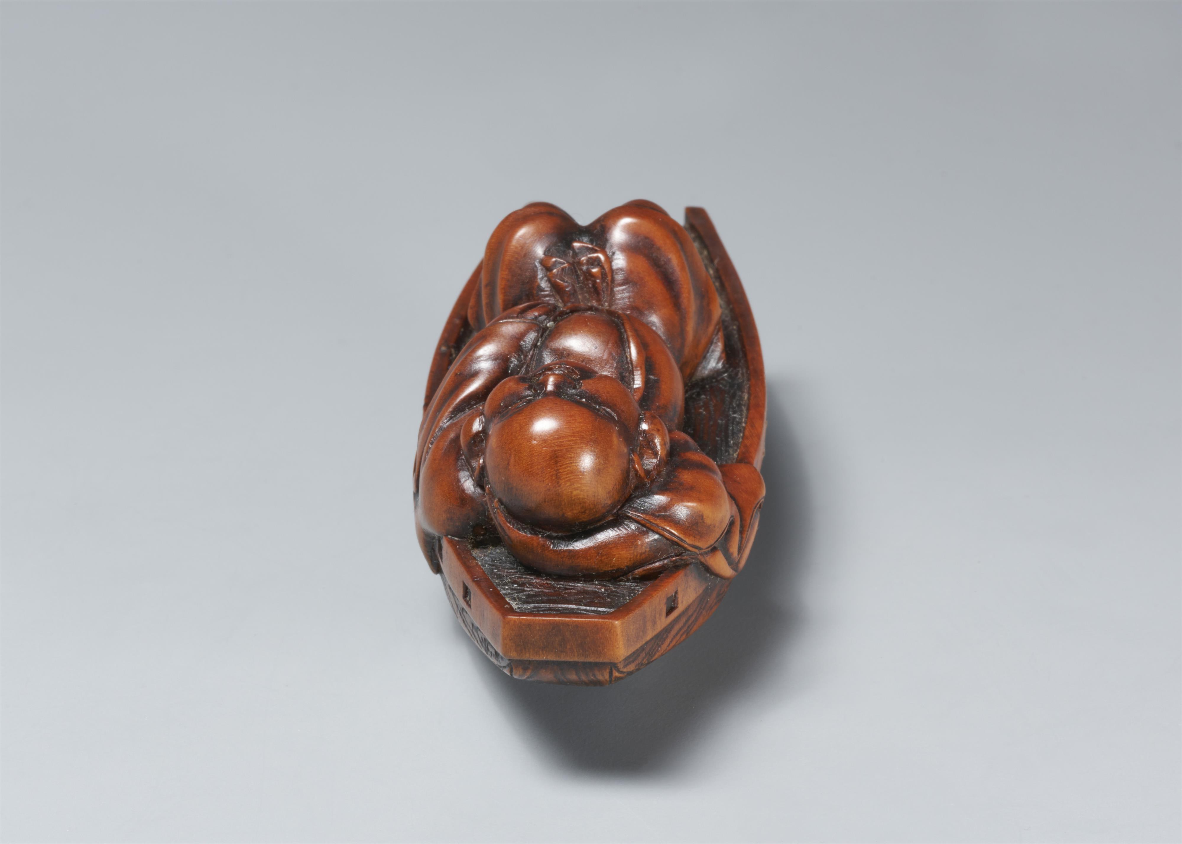 A boxwood netsuke of Hotei resting in a boat. Late 19th century - image-3