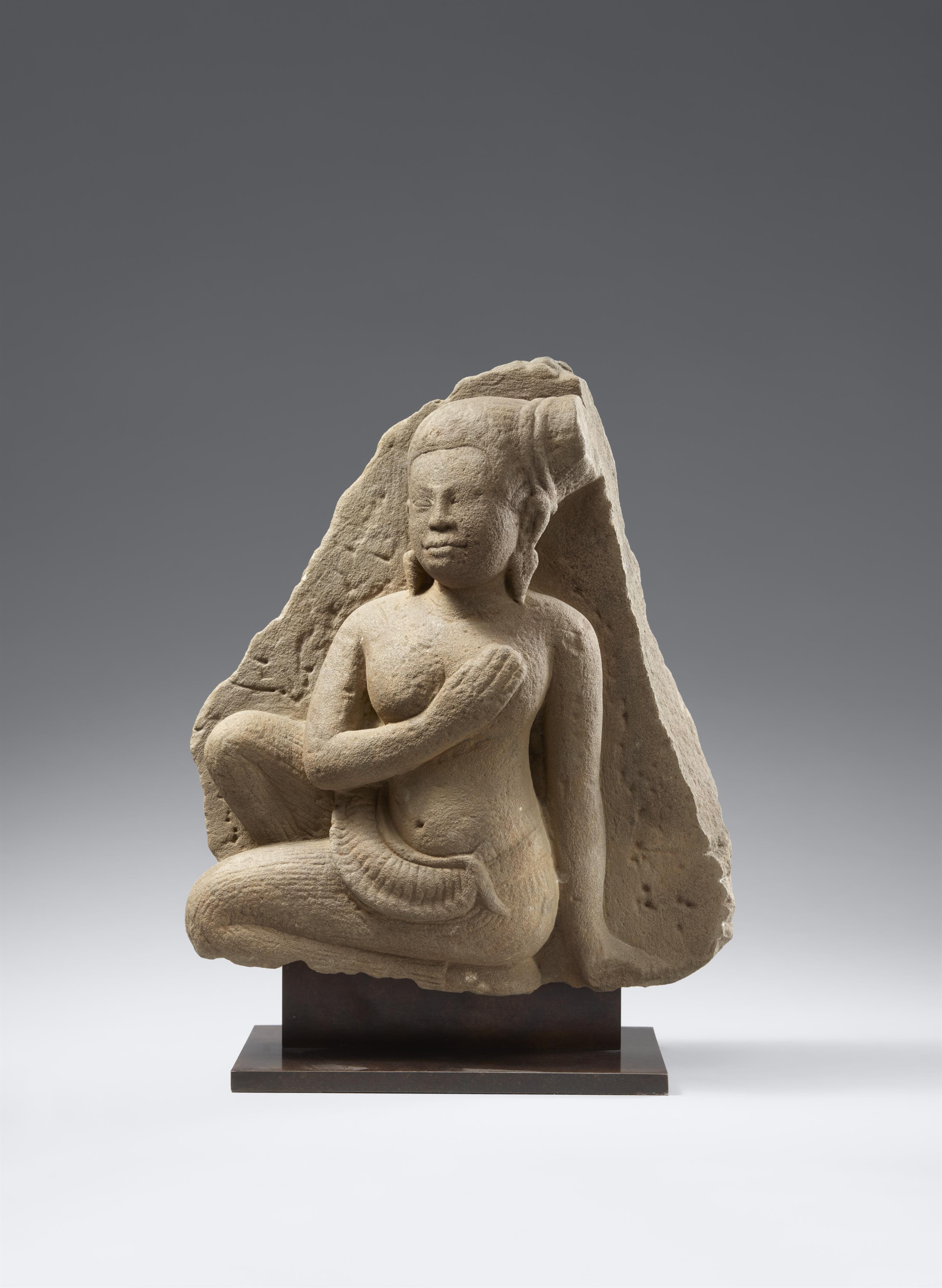 An Angkor Wat-style sandstone figure of a female attendant. Cambodia. 12th century - image-1