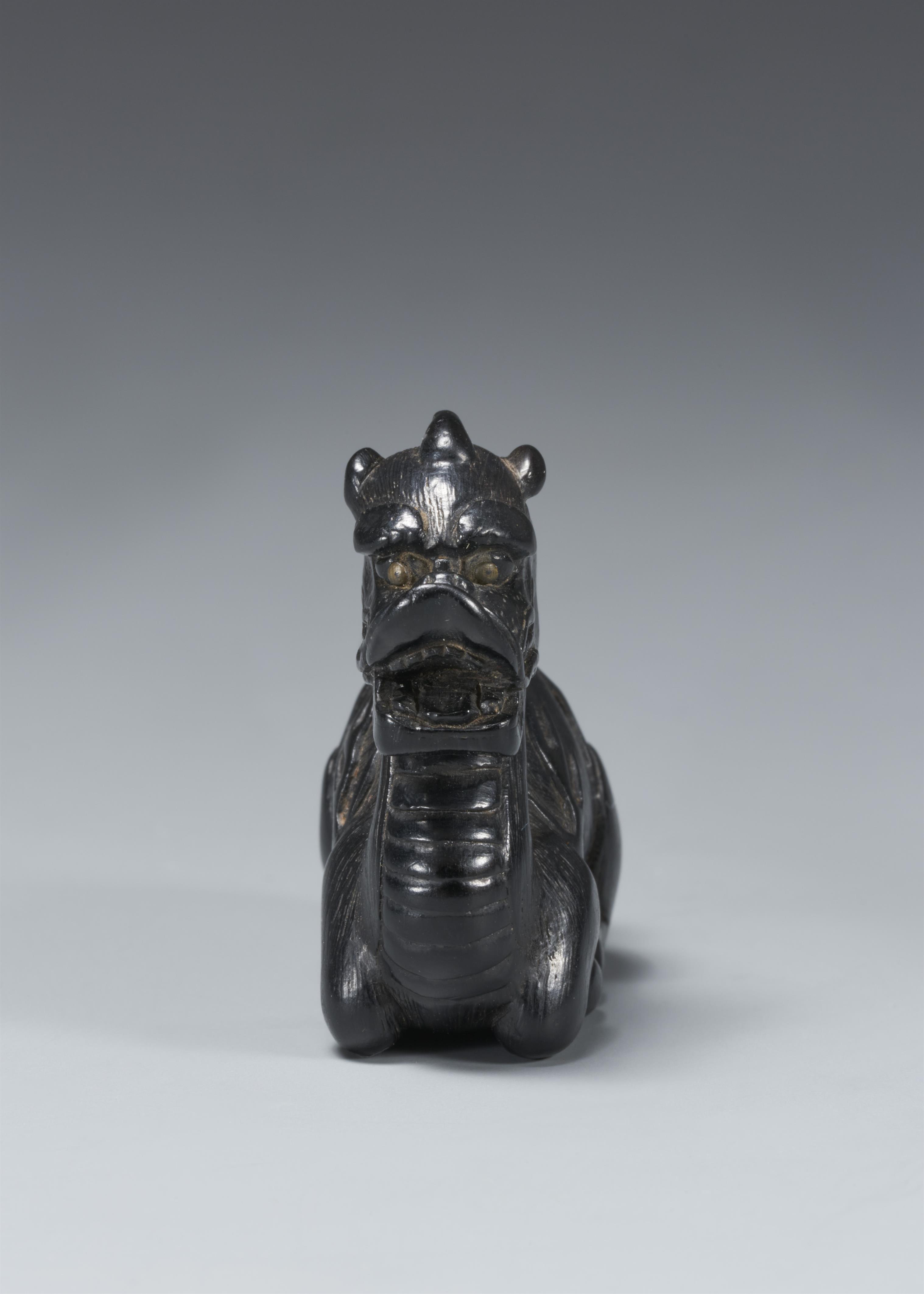 A blackwood netsuke of a seated kirin. 19th century - image-3