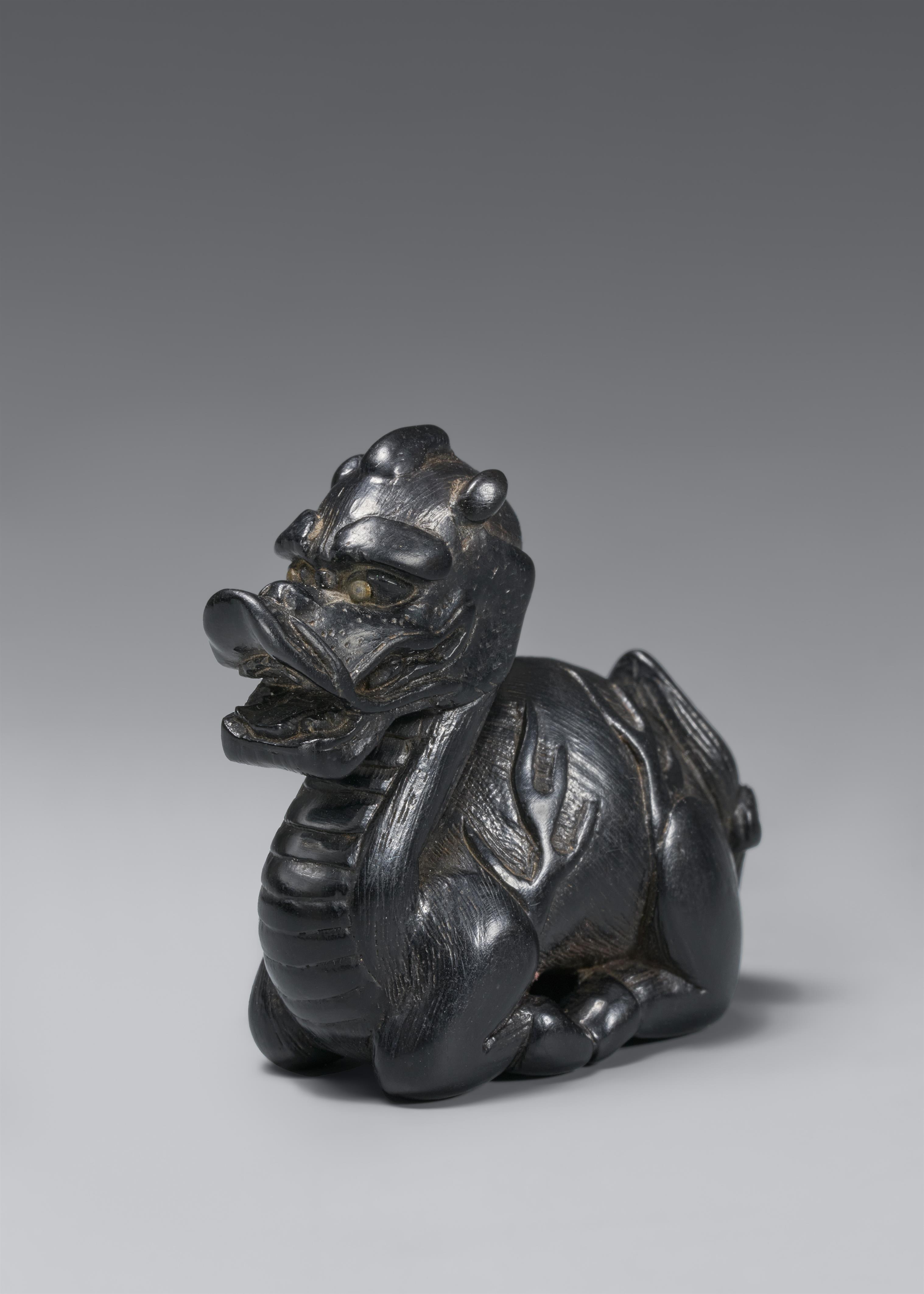 A blackwood netsuke of a seated kirin. 19th century - image-1