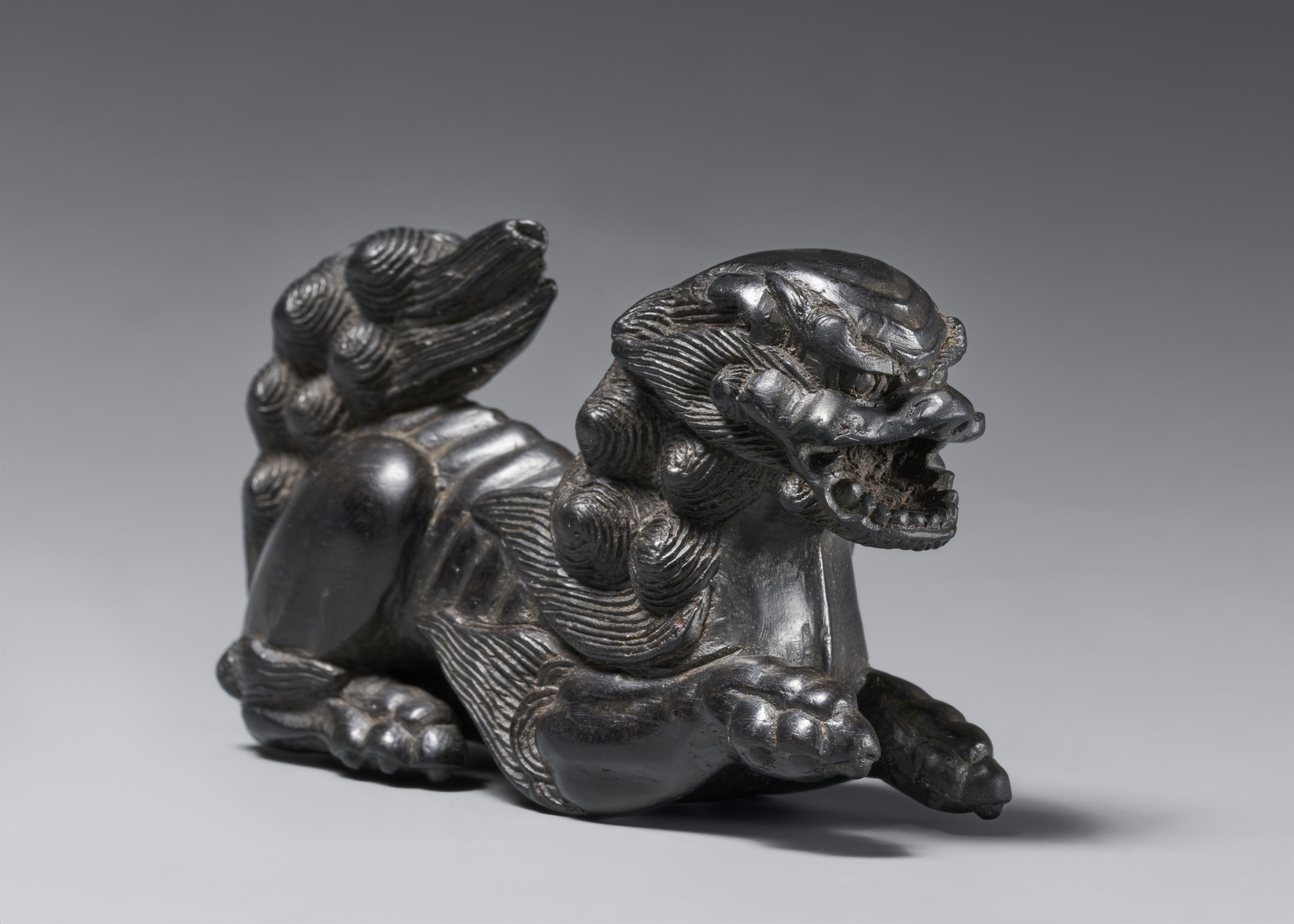 A large kokutan netsuke of a shishi. 19th century - image-1