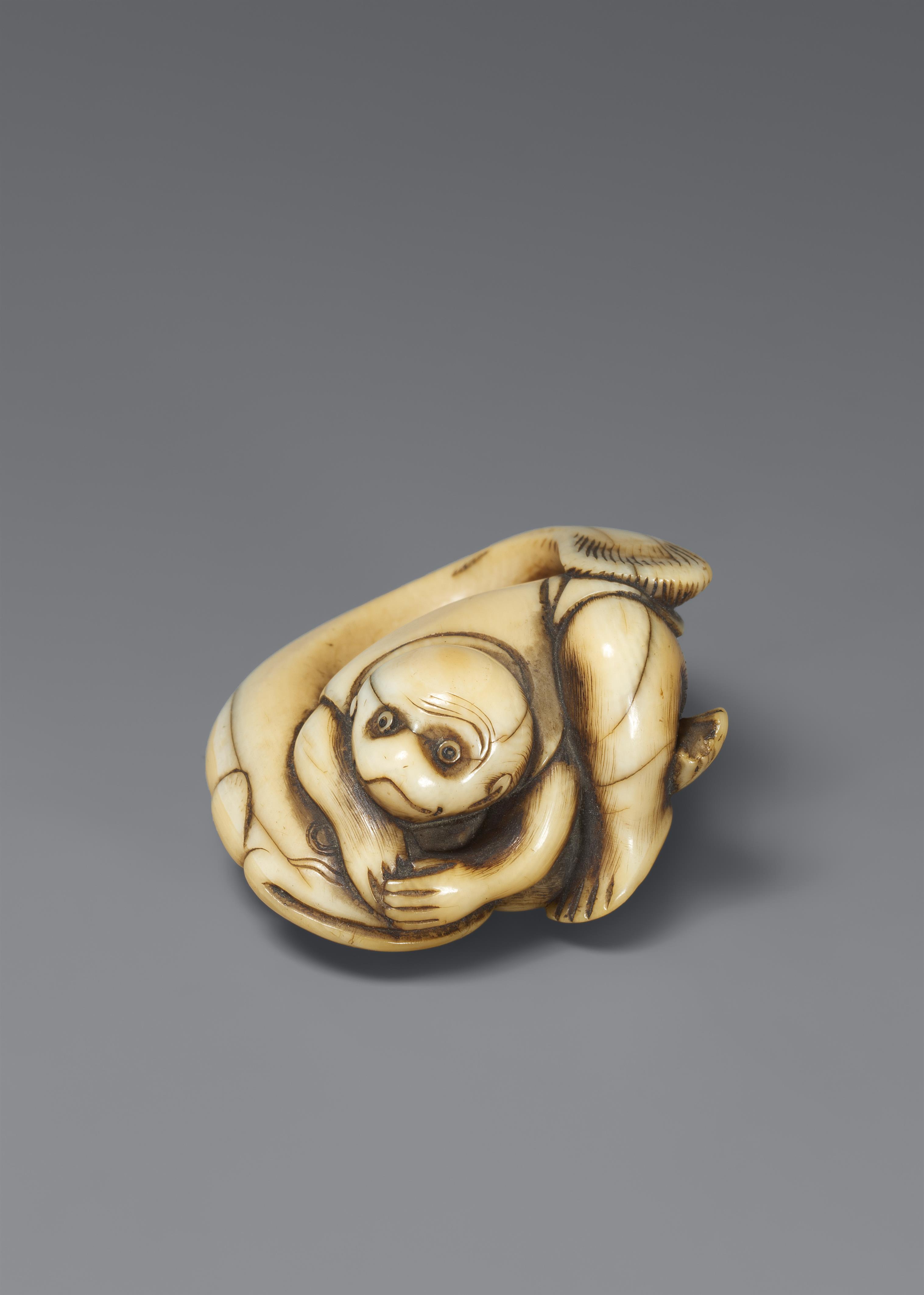 An ivory netsuke of a monkes keeping down the earthquake fish.18th century - image-1