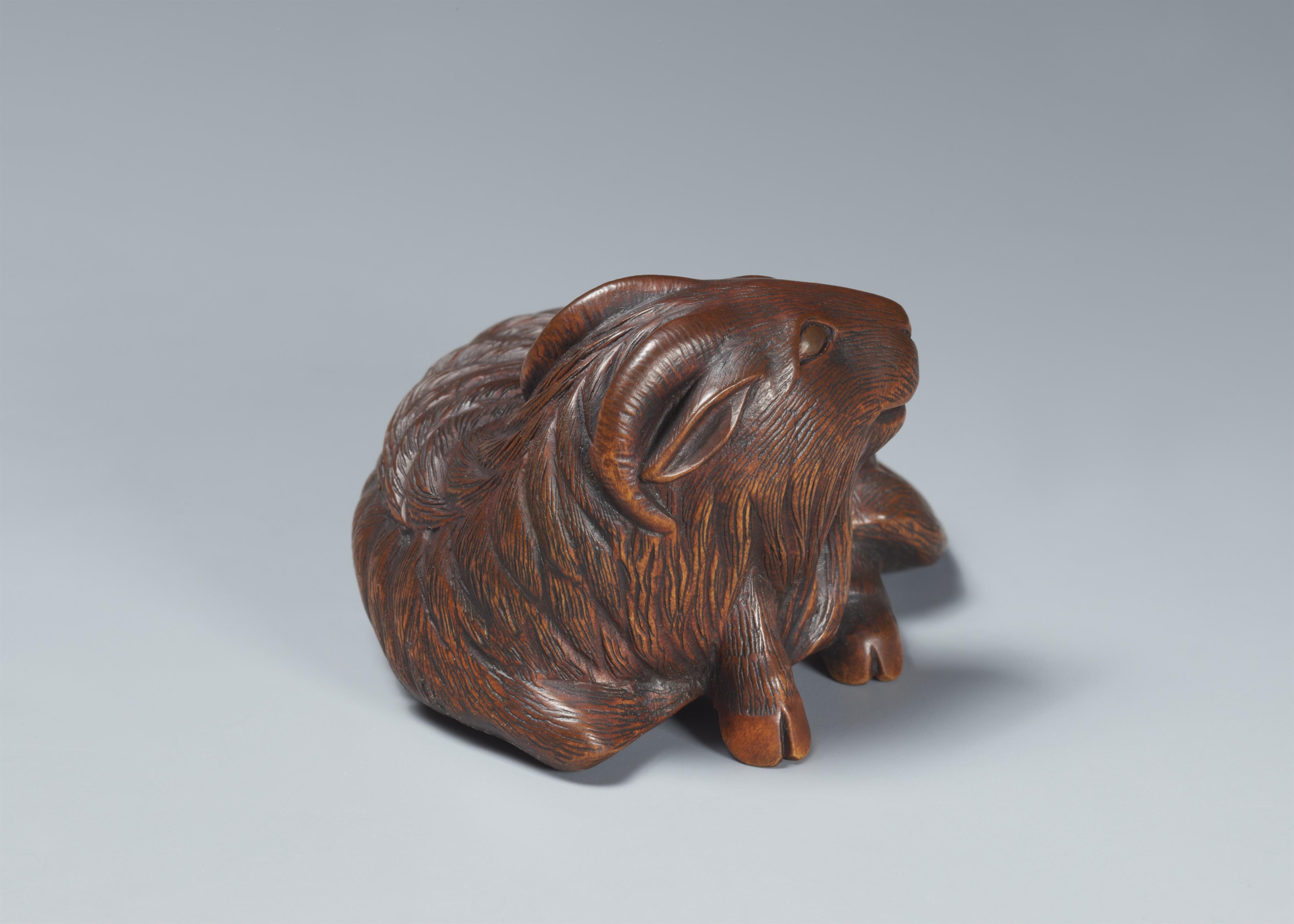 An Ise-Yamada boxwood netsuke of a long-haired goat. Around 1970 - image-4