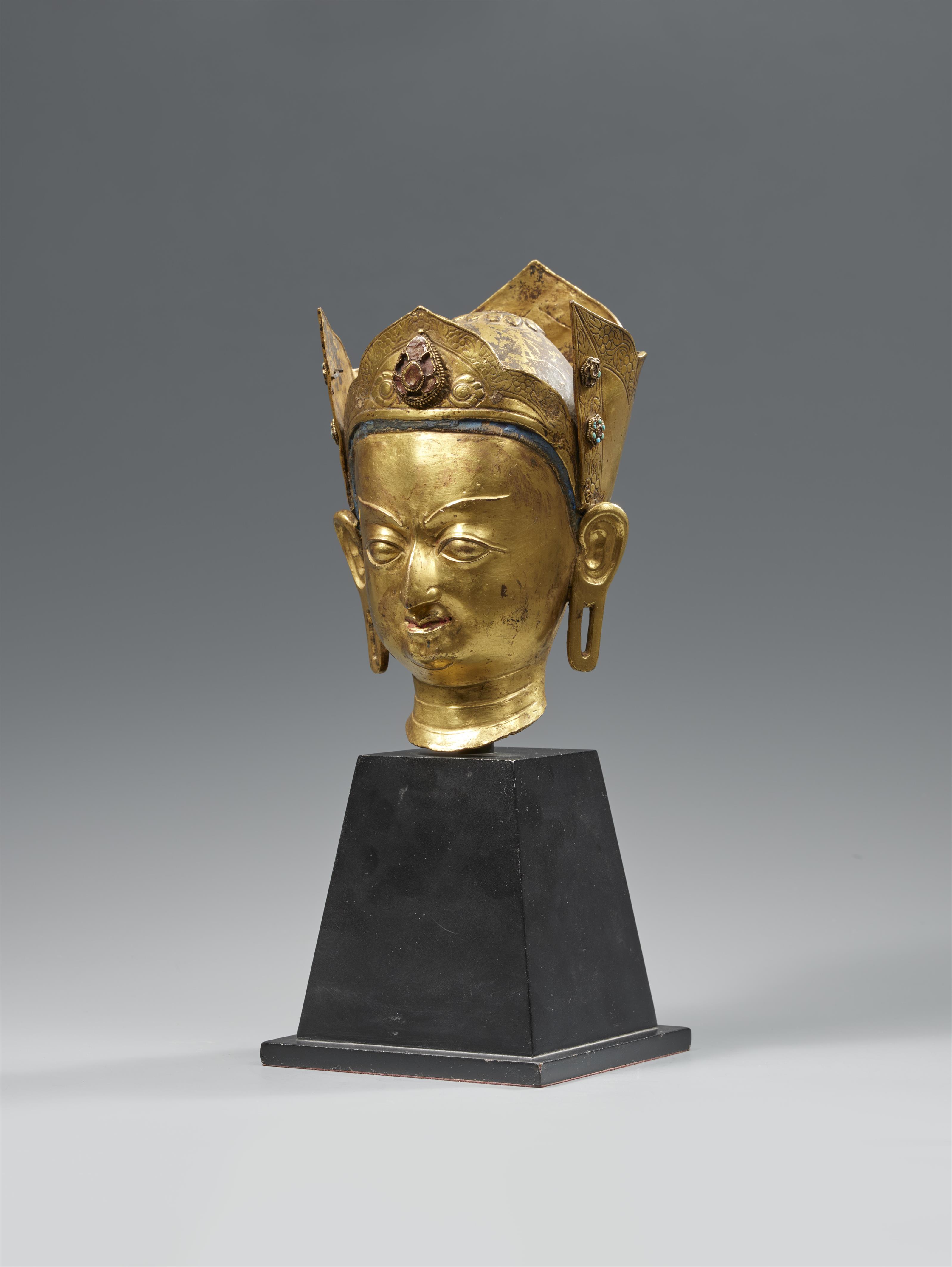 A fire-gilt bronze head of Padmasambhava. Tibet. 18th century. - image-2