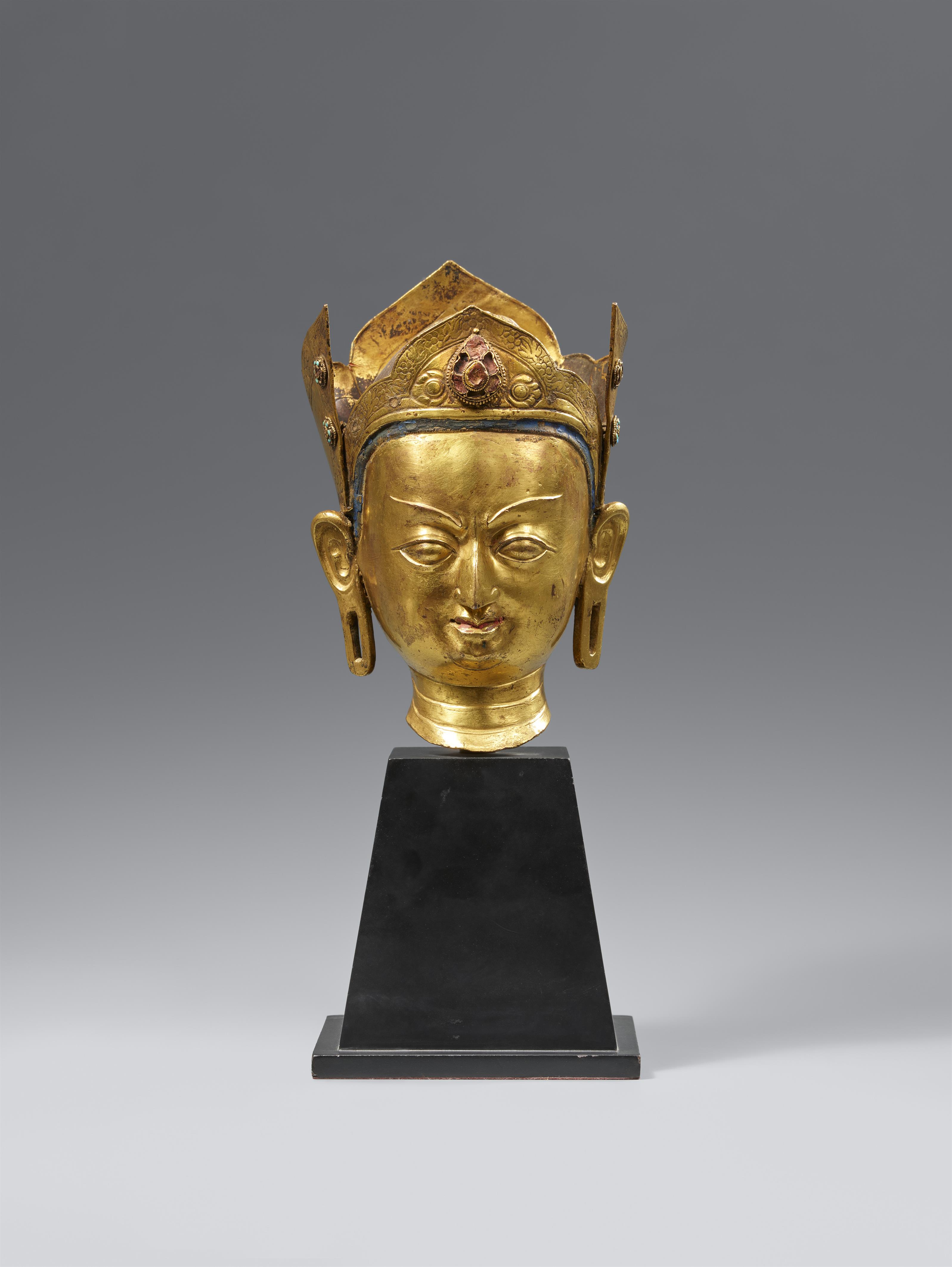 A fire-gilt bronze head of Padmasambhava. Tibet. 18th century. - image-1