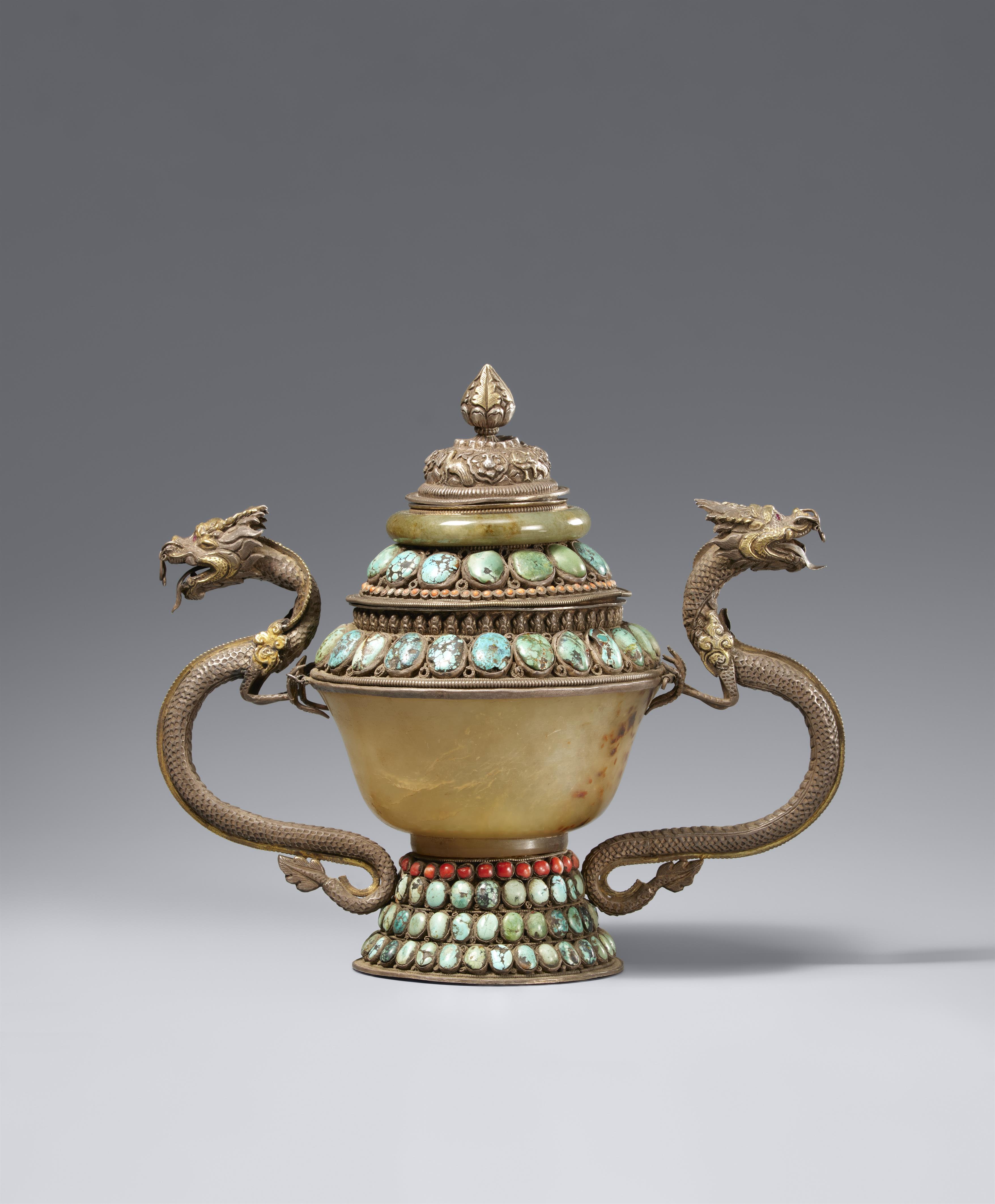 A silver-mounted and inlaid turquoise, coral and jade-embellished bowl and cover. Tibet, 19th/20th century - image-1
