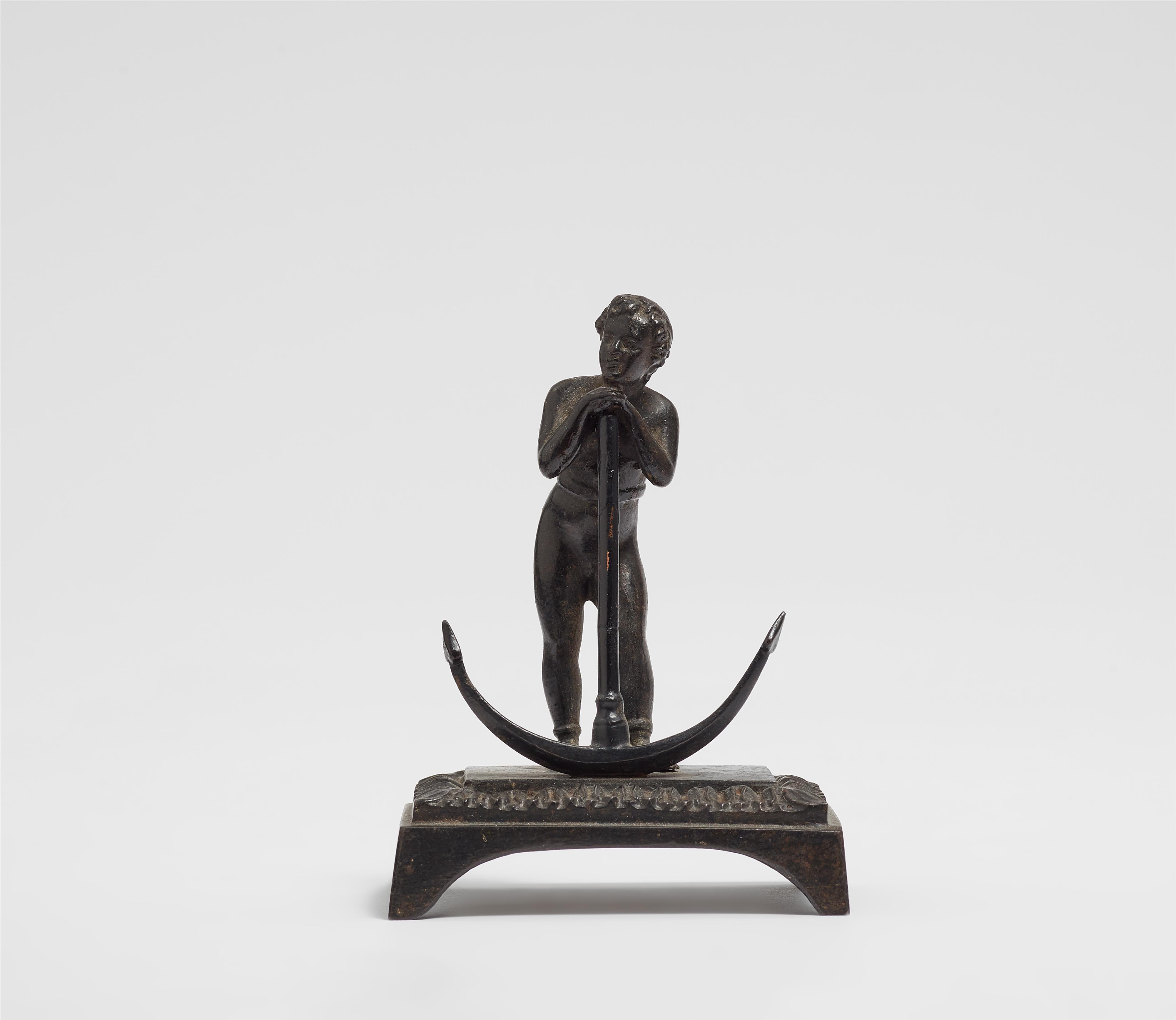 A cast iron statuette of an allegory of Spes - image-1