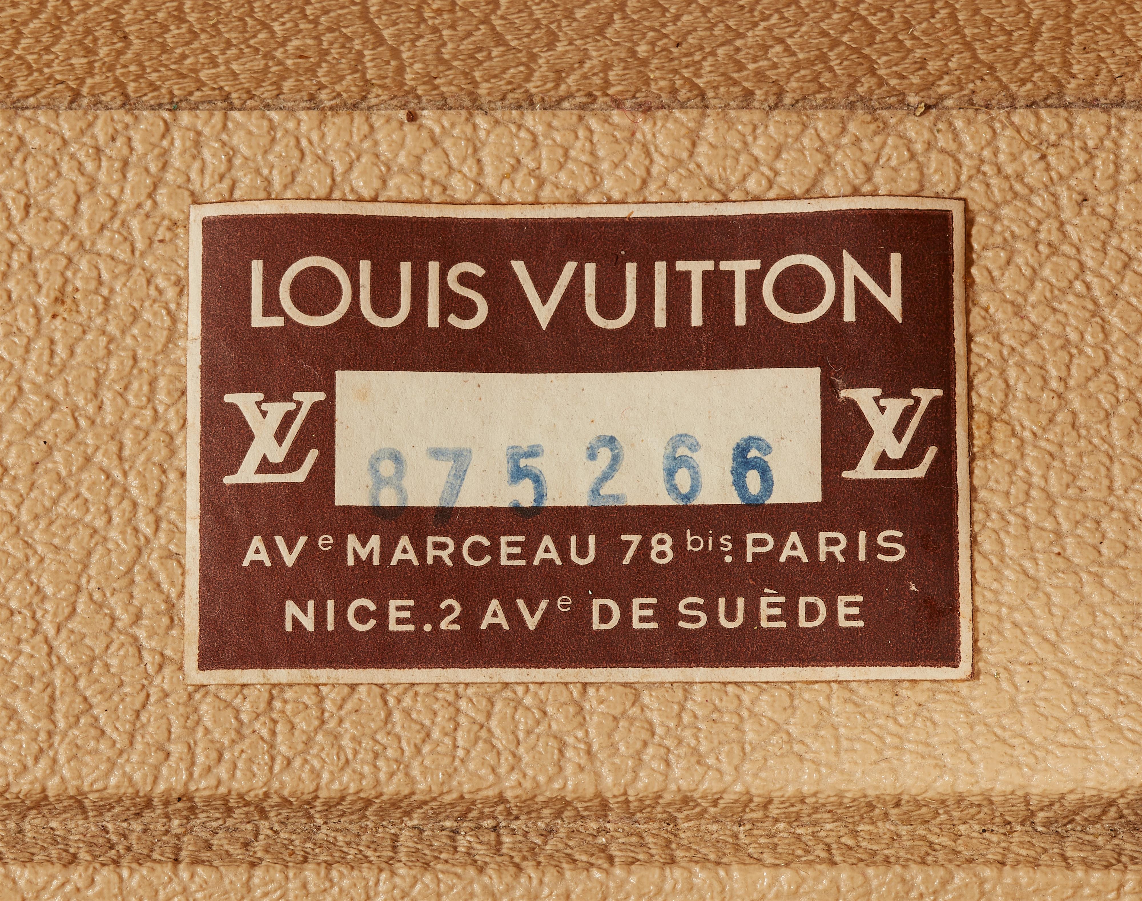 A Louis Vuitton suitcase - image-2