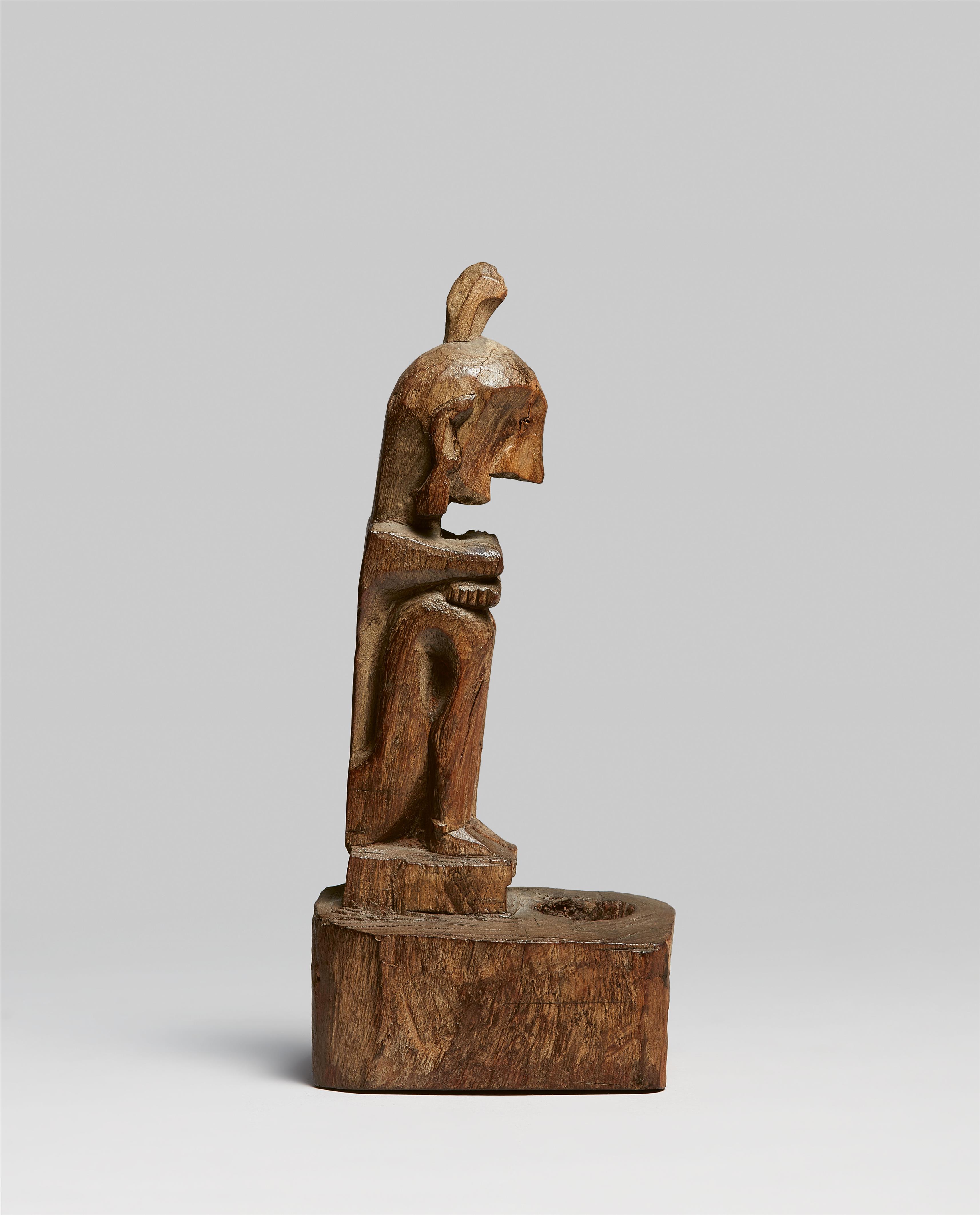 MOLUCCAS SEATED FIGURE - image-1