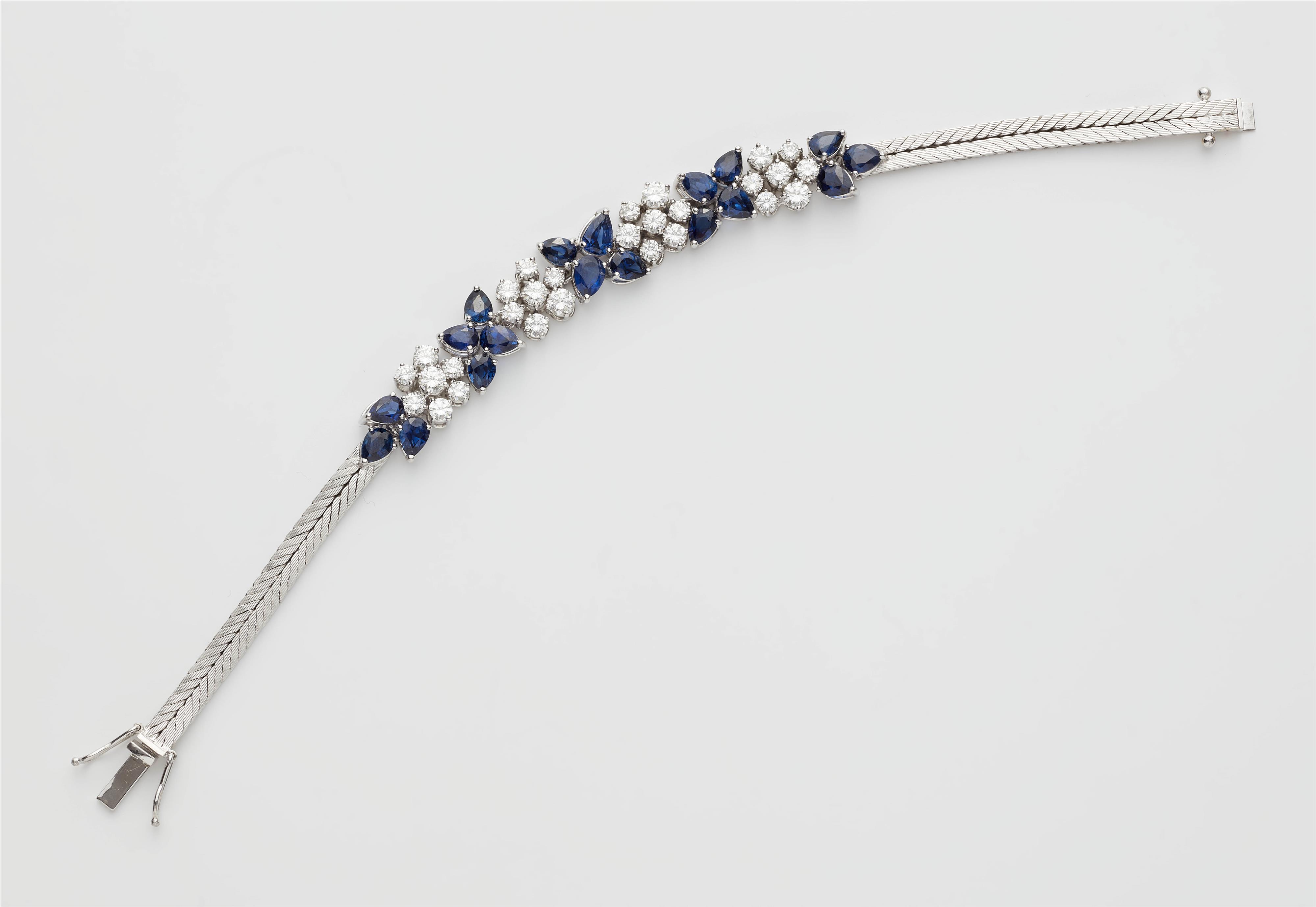 An 18kt white gold diamond and sapphire bracelet. - image-1