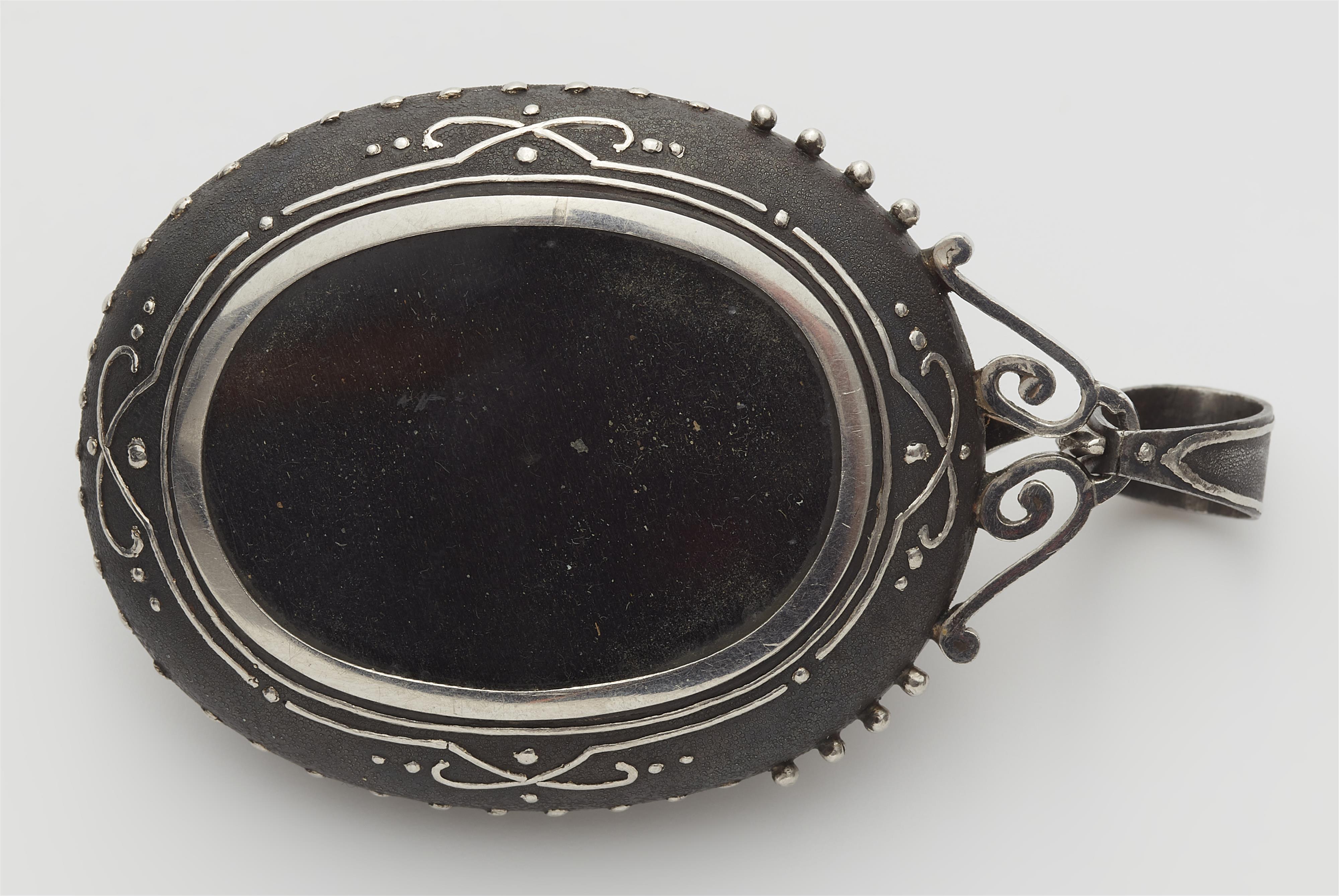 A possibly French late 19th century blackened iron platinum pearl and diamond locket pendant. - image-2