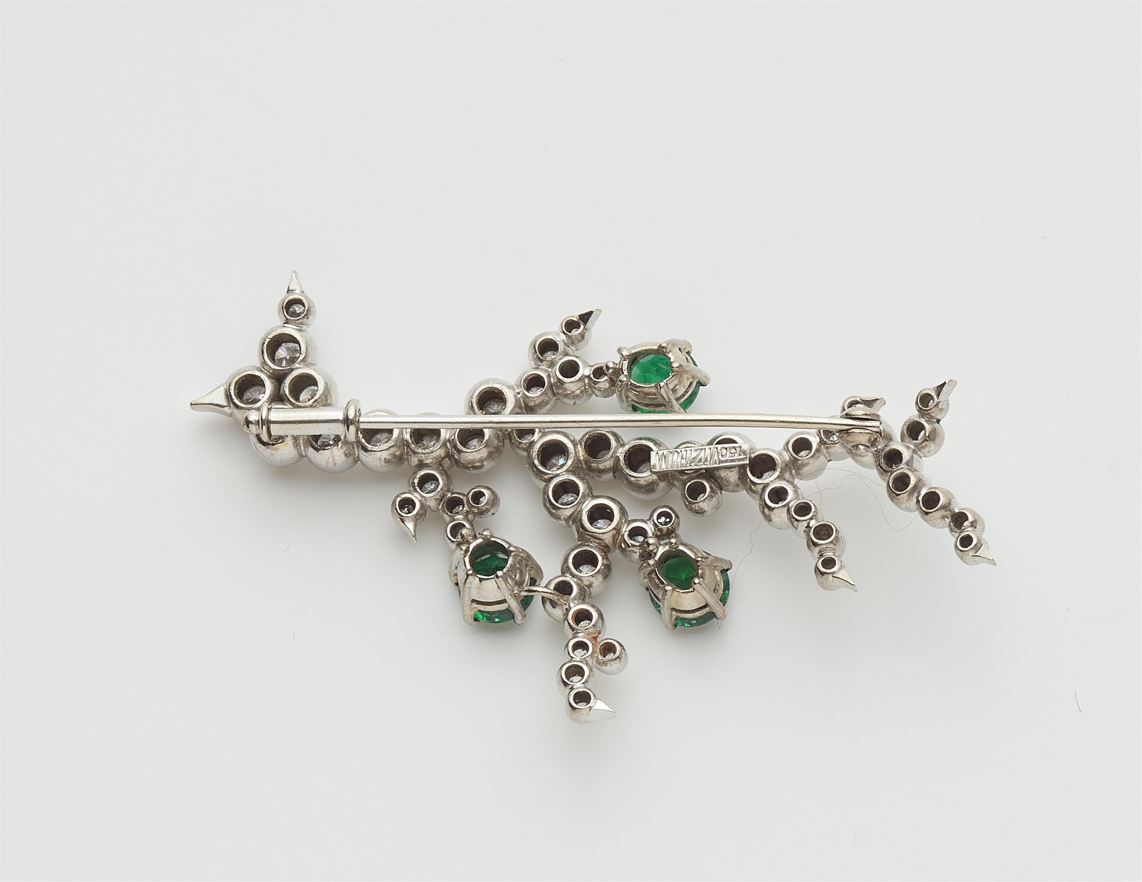 A German 18k gold diamond and emerald flower brooch. - image-2